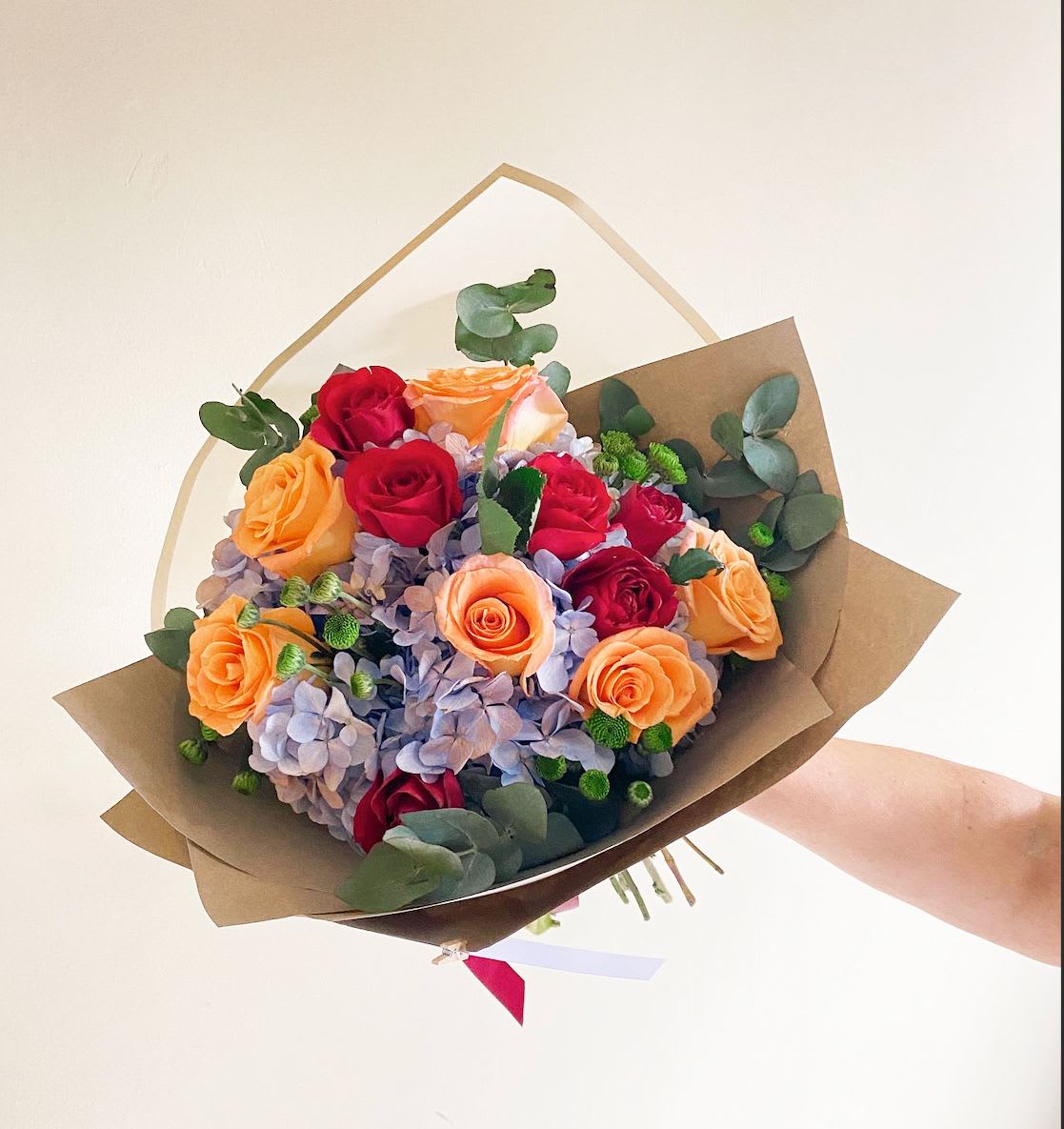 Blue Hydrangeas and 12 Roses in a Wrapped Bouquet - Blue Hydrangeas and 12 Roses in a Wrapped Bouquet with accents of ecucalyptus. ****Paper and Flower color may vary depending on availability****