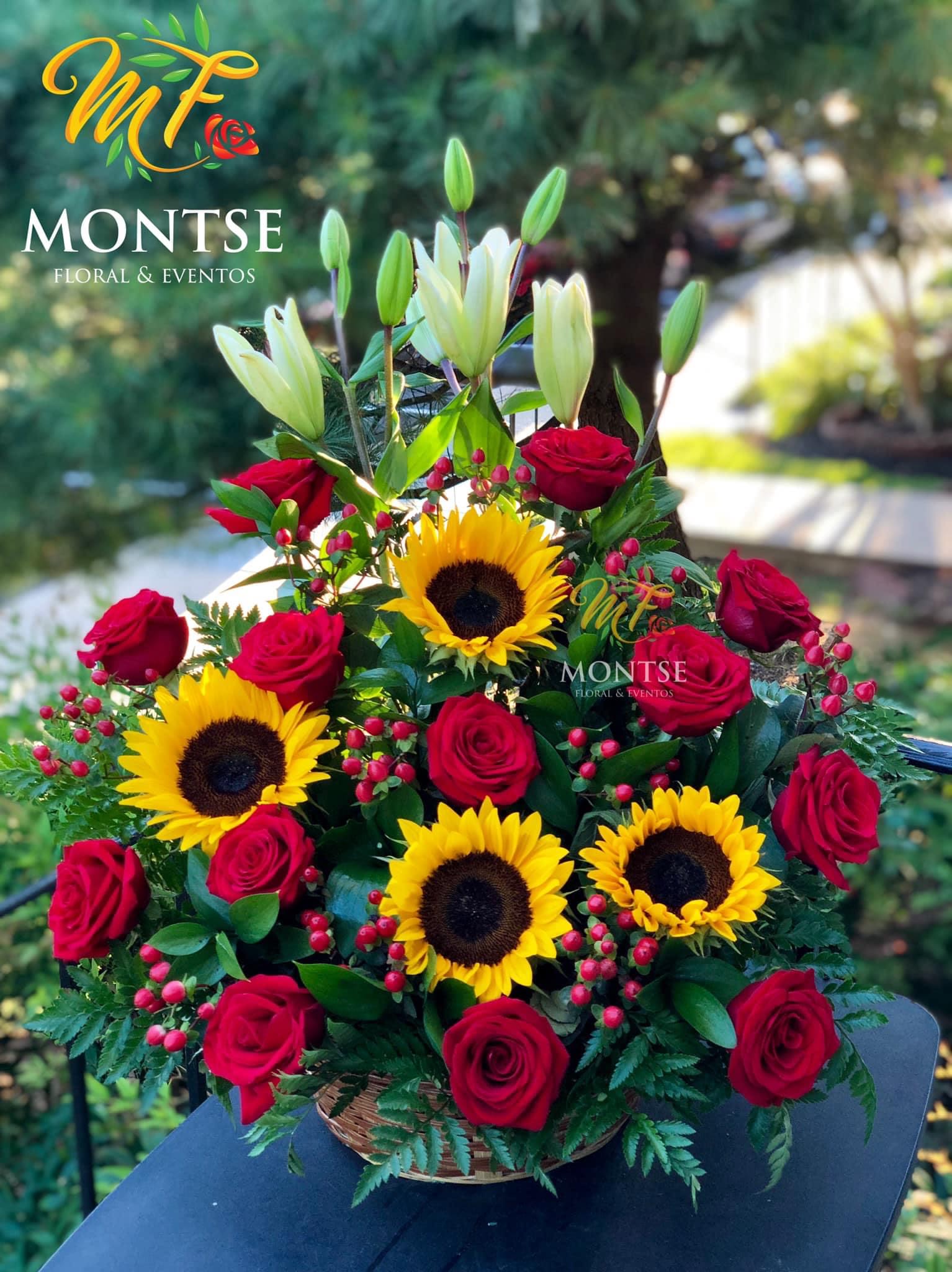 Carmen  - Big basket of red roses , sunflowers, hypericum  and white lilies .