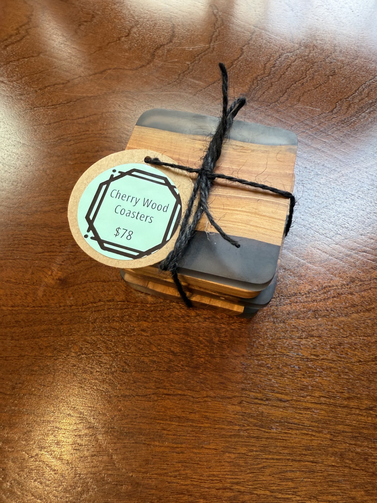 Cherry Wood Coaster - Elevate your tabletop with our Cherry Wood Coasters by Dapper Wood Atelier, a Filipino-owned studio based in San Francisco. Handcrafted from locally sourced cherry wood, each coaster features a smooth, satin finish that brings out the natural beauty of the grain. A soft felt bottom protects surfaces, combining thoughtful design with everyday function. Set of four.