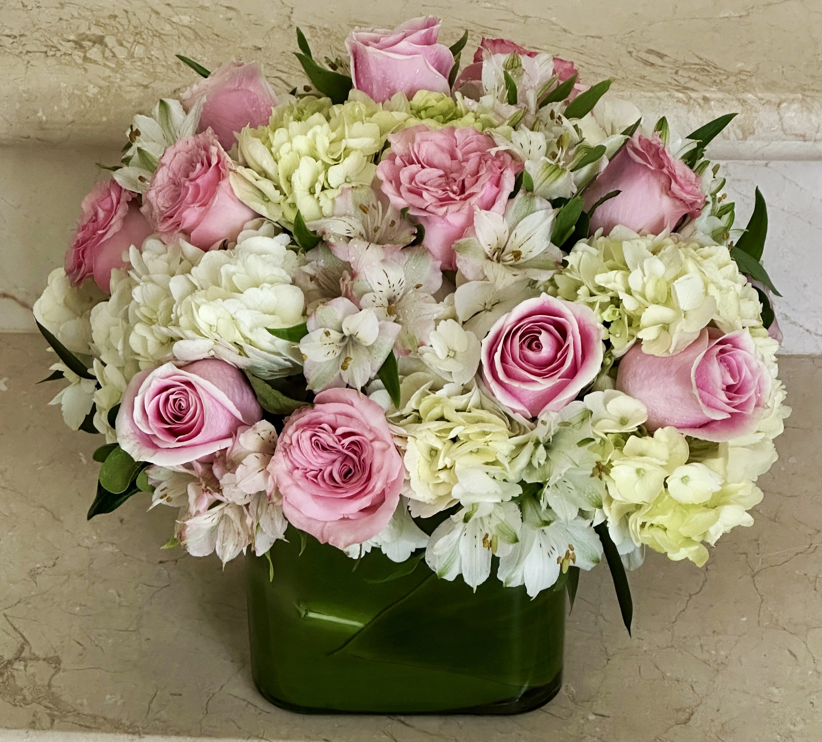Blushing Beauty - Pink Roses with White Hydrangeas arranged in a square glass vase.