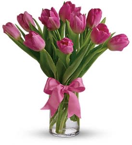 10 Pink Tulips arranged in a vase with a bow. - Standard as shown: 10 Pink Tulips arranged in a vase Premium - 20 Pink Tulips arranged in a vase with a bow.