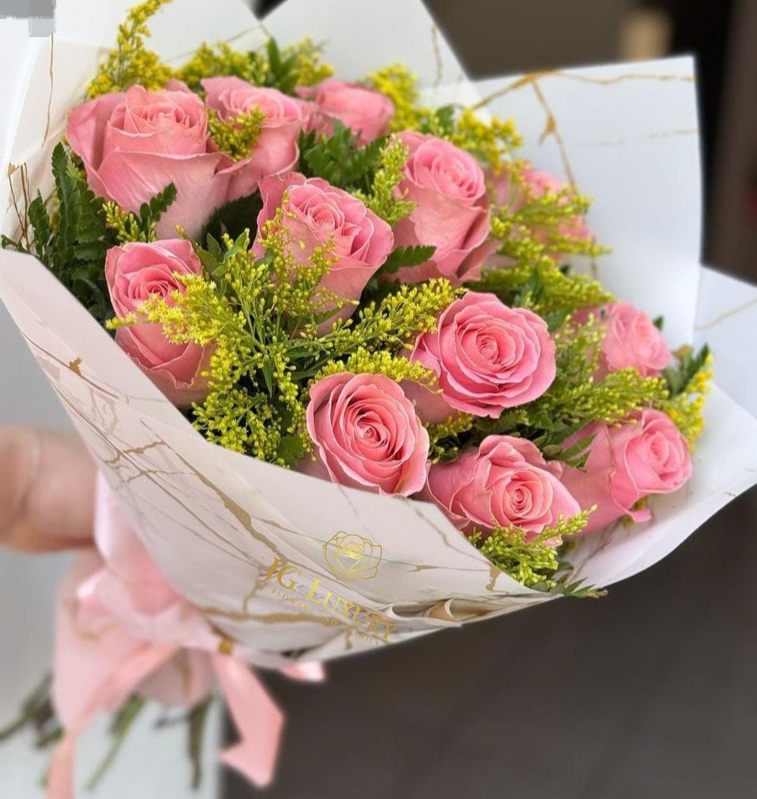 Pinkie - Classic wrapped arrangement of pink roses and greeneries filled with our unique touch of love.