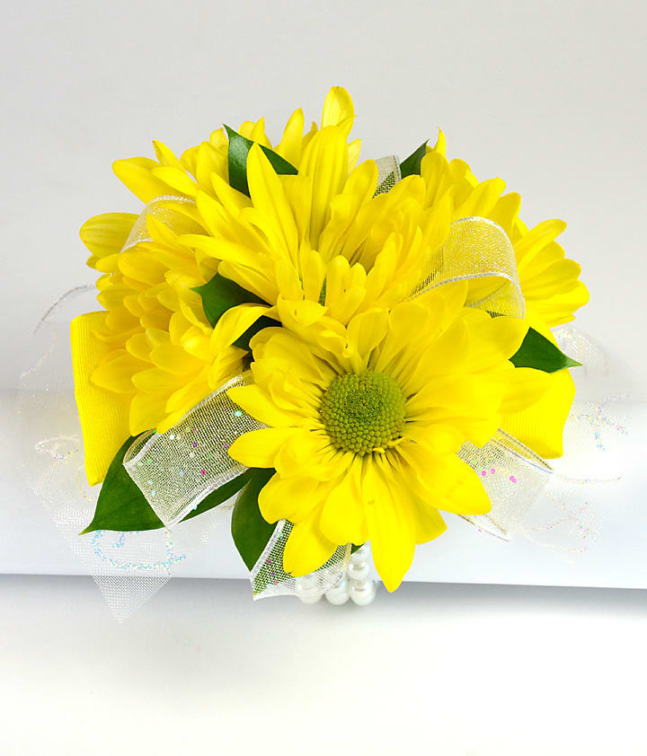 Lemon Drop Wrist Corsage - Petite for Child - The yellow chrysanthemum daisies are a durable flowers, perfect for all ages. This corsage size is for a child 10 and under. Ribbon color is chosen based on dress color.  When ordering this corsage, please add the dress color and age of girl in the special instructions.