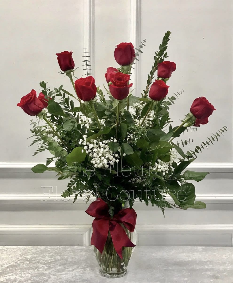 One Dosen Red Roses - One dozen red roses in a tall vase.