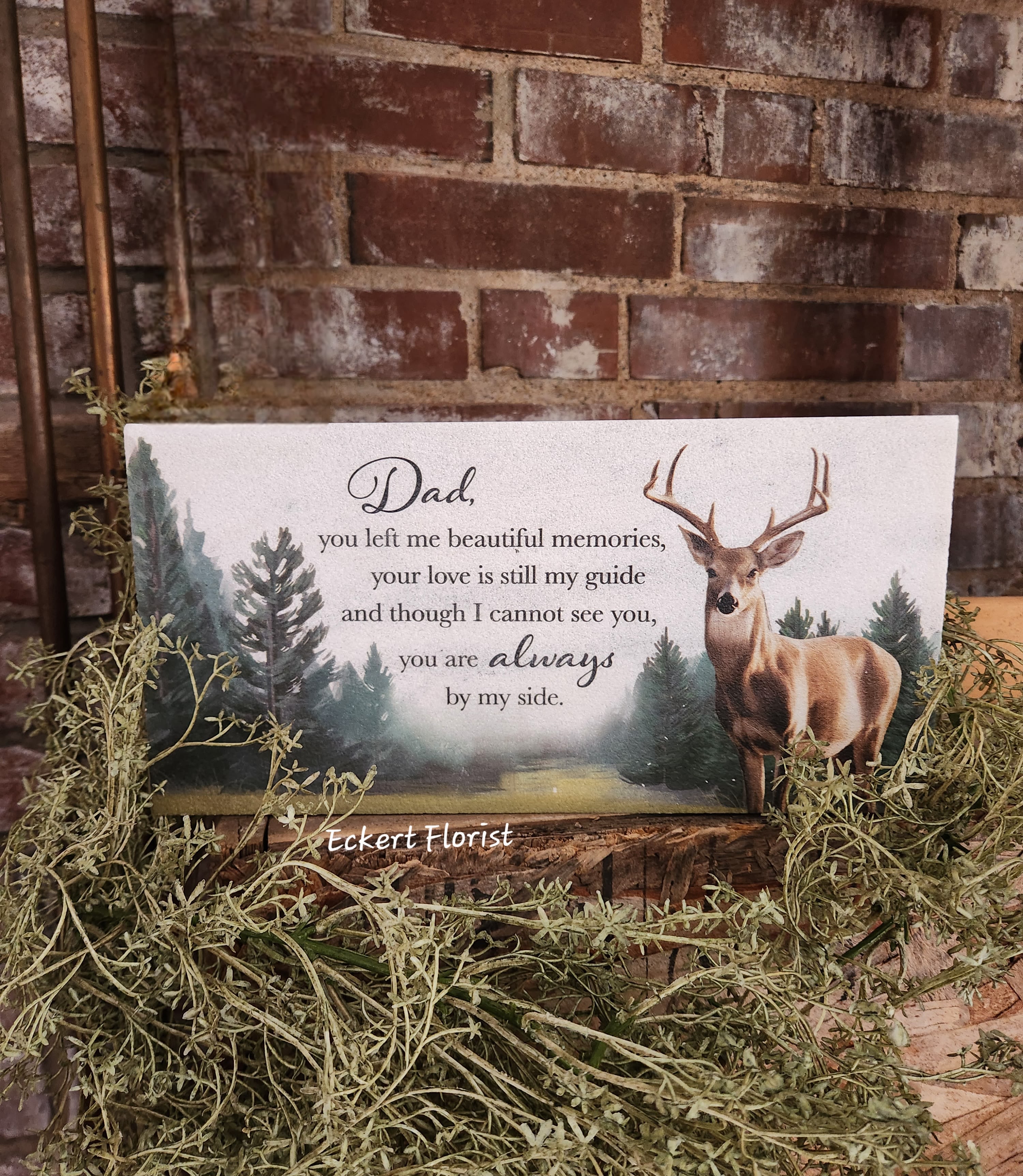 Eckert Florist's "Dad..." Marble Paver Memorial Stone *Our Local Delivery Only Eckert Florist's "Dad..." Marble Paver Memorial Stone *Our Local Delivery Only - This fine Turkish Marble weather friendly stone will make a perfect memorial gift. Sentiment on stone: "Dad, you left me beautiful memories, your love is still my guide and though I can not see you, you are always by my side." Designed and printed in the USA, this stone measures 6" H x 12" W x 1" *Our Local Delivery only