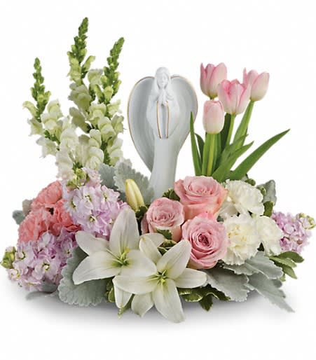Garden of Hope Bouquet - Show them you care with this gorgeous display of roses, lilies and tulips, gracefully surrounding a timeless angel sculpture keepsake. Beautifully fragrant, it's a hopeful tribute that will warm their hearts forever.  This lovely arrangement of light pink roses, light pink tulips, white asiatic lilies, light pink carnations, white carnations, white snapdragons and light pink stock is accented with dusty miller and variegated pittosporum. Delivered with Teleflora's Angel of Grace keepsake. Approximately 18&quot; W x 16 1/2&quot; H