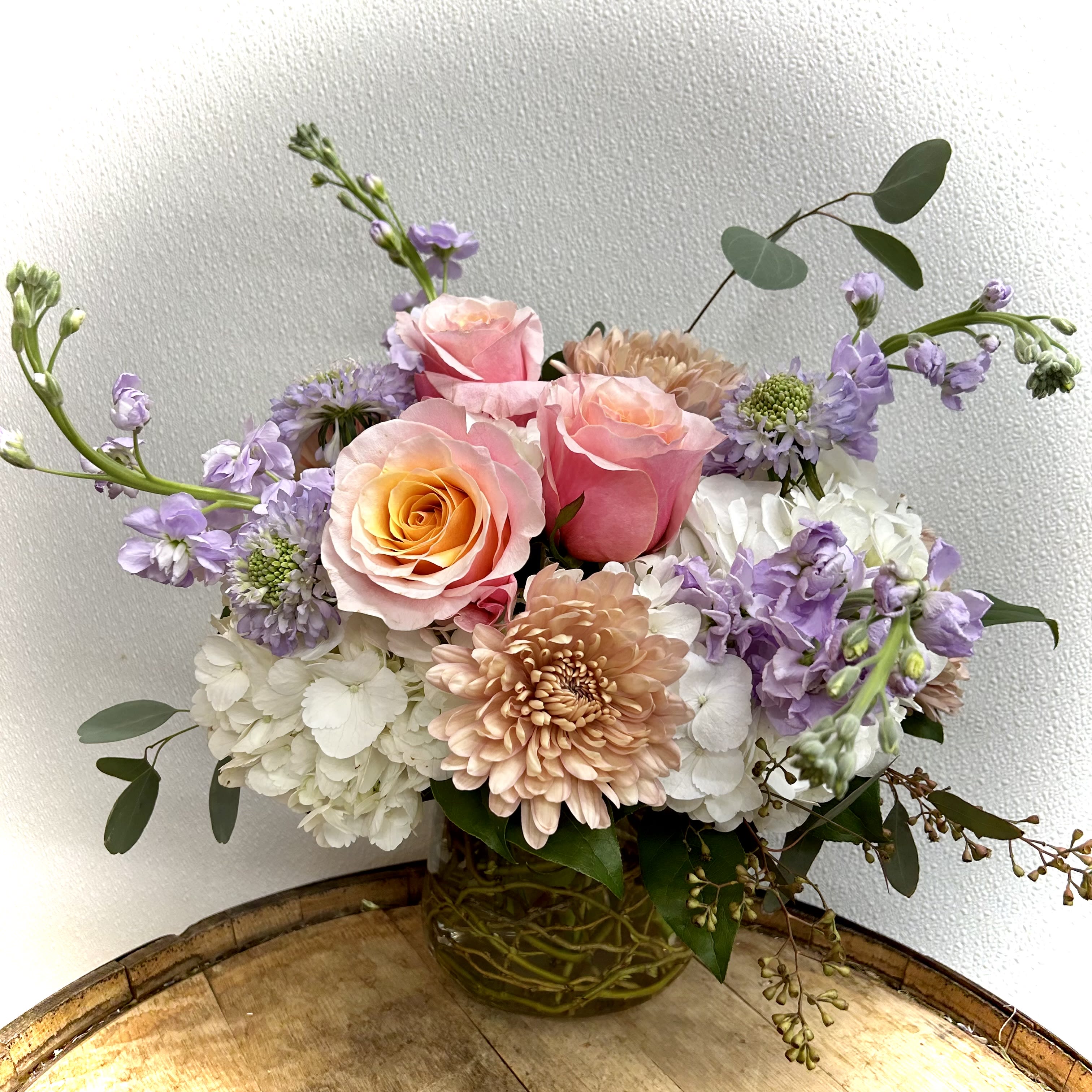 #1 Mom - Soft palette of florals in curly willow filled glass vase and eucalyptus accents 