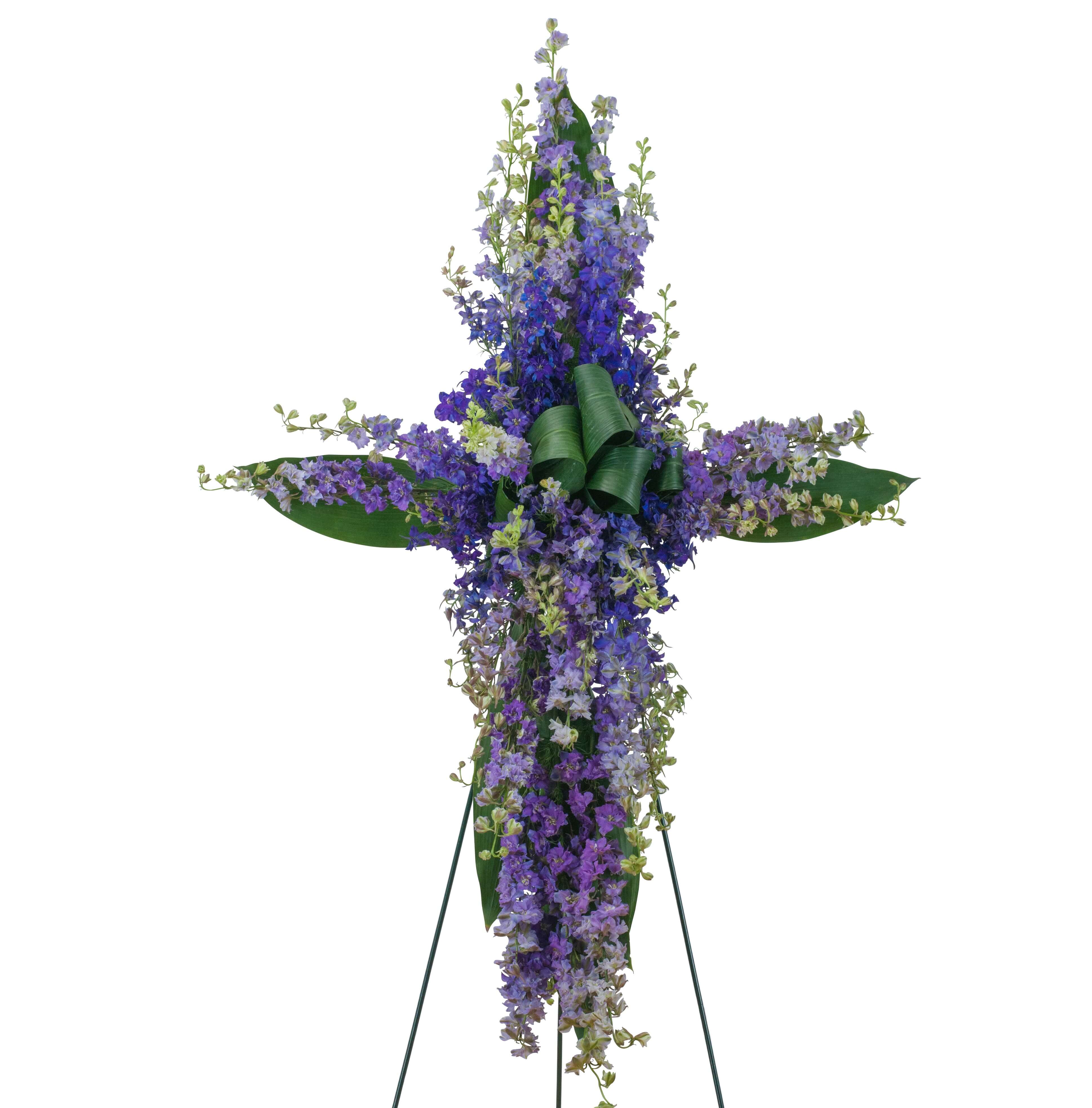 Lovely Lavender Cross Lovely Lavender Cross - Beautiful Lavender Larkspur forms the shape of a cross for this lovely tribute.
