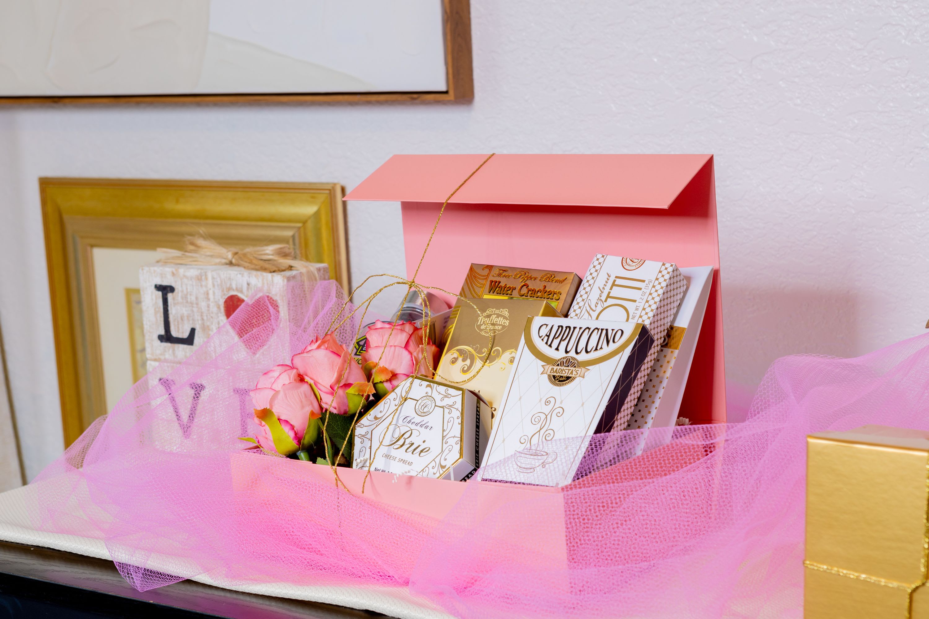 Golden Bliss - A delightful gift box featuring gourmet treats, delicate blooms, and elegant gold accents, perfect for any occasion.