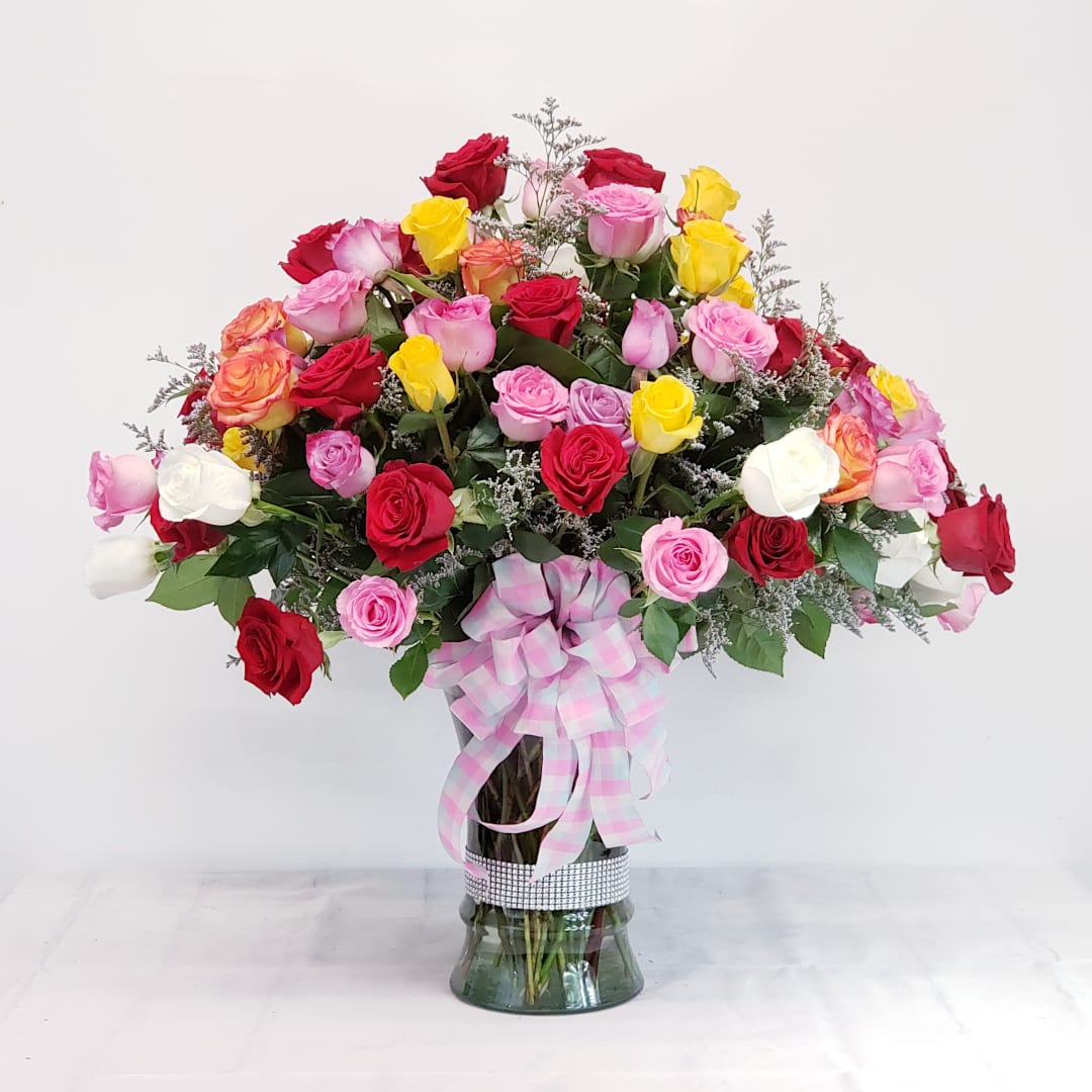 Spectacular 100 Rose Bouquet - Breathtaking, spectacular beauty! Our finest mixed color long stem roses set in a banded premium vase. When you want to make an impression that truly impresses, this is the bouquet for you! 