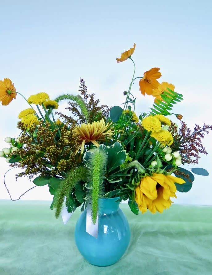 Gardenesque - A design of seasonal blooms artfully set in a fun vase.