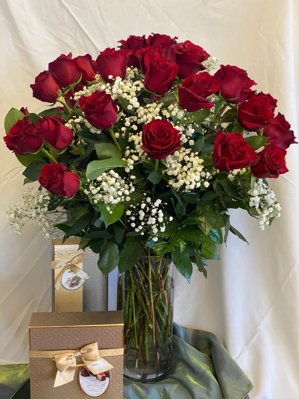 #2 - Tall Two Dozen Red Roses #2 - Tall Two Dozen Red Roses - These two dozens of red roses in a clear vase are accented with baby's-breath. CHOCOLATES ARE NOT INCLUDED. Chocolates are sold separately. These tall roses reach 60-70cm in height.