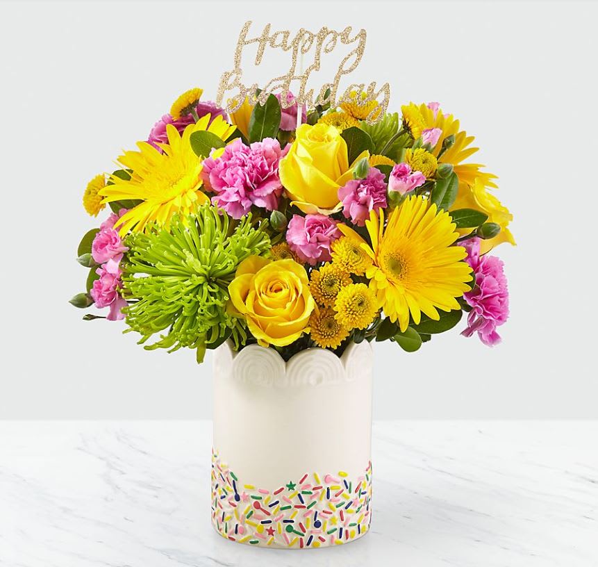 Birthday Sprinkles ™ Bouquet Birthday Sprinkles ™ Bouquet - It’'s true: sprinkles make everything better. Overflowing with roses, carnations, gerbera daisies and a glittering “Happy Birthday” pic, this handcrafted bouquet puts the cherry on top of any celebration. Good bouquet is approx. 12"H x 12"W. Better bouquet is approx. 13"H x 13"W. Best bouquet is approx. 14"H x 14"W.