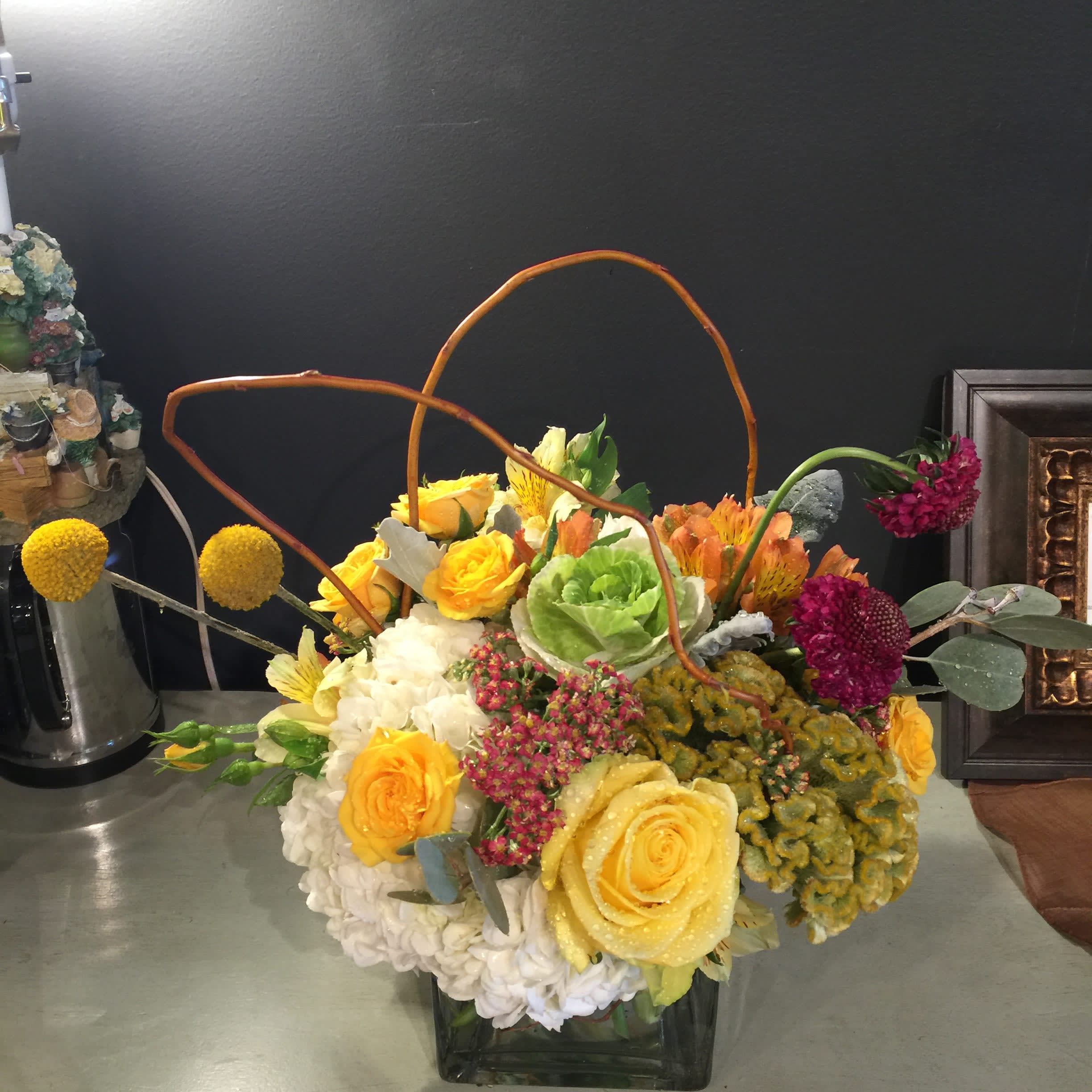 SG-42 - This small sized arrangement is for someone who's looking for not-so-ordinary flower arrangement.  *substitution - In this event, we will substitute with a second choice of similar flowers and container of equal value and beauty. Every effort will be made to maintain size, shape, and overall color schemes of an arrangement.