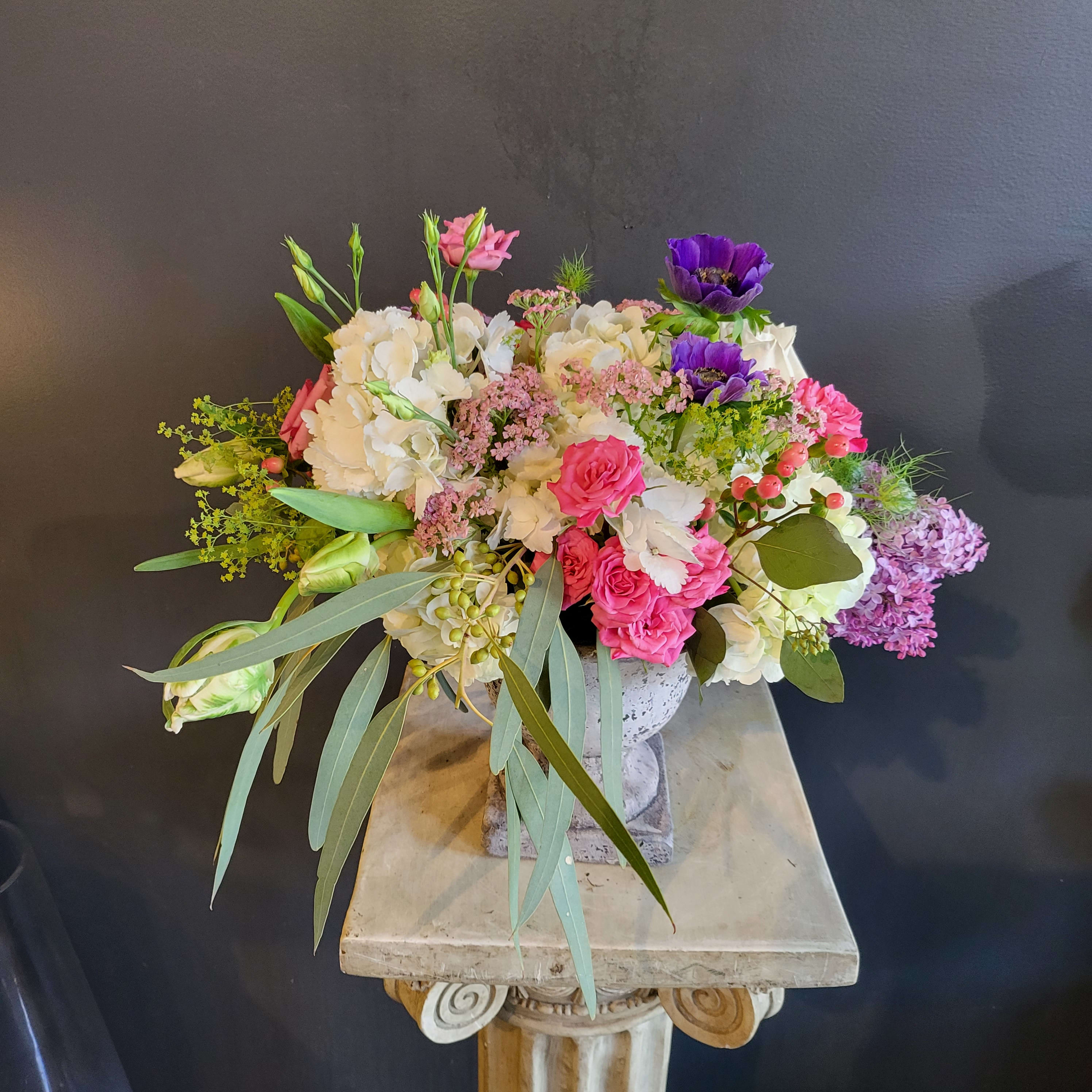 SG-58 - Beautiful arrangement in a antique styled urn. 