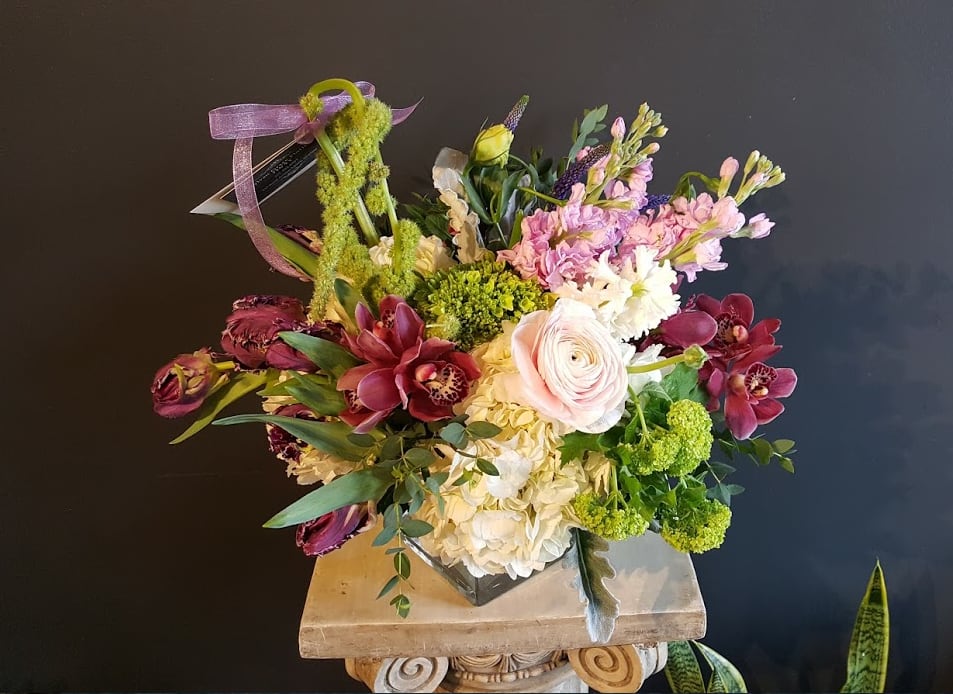 SG-24 - If you are not a huge fan of roses, and looking for extra long lasting flowers, these arrangement will be your favorite.   Please note that since we use the freshest flowers that are in stock, colors of cymbidium can change. If you are looking for a specific color, please leave a note for our florists. Most importantly - Do Not choose &quot;Same day delivery&quot;  Due to various seasonal and regional conditions, and the variety of unplanned issues courtesy of Mother Nature, availability of some flowers may be very limited in certain areas.  In this event, we will substitute with a second choice of similar flowers and container of equal value and beauty. Every effort will be made to maintain size, shape, and overall color schemes of an arrangement. Our goal is your complete satisfaction, rest assured that every effort will be made to provide an arrangement of equal or greater value.