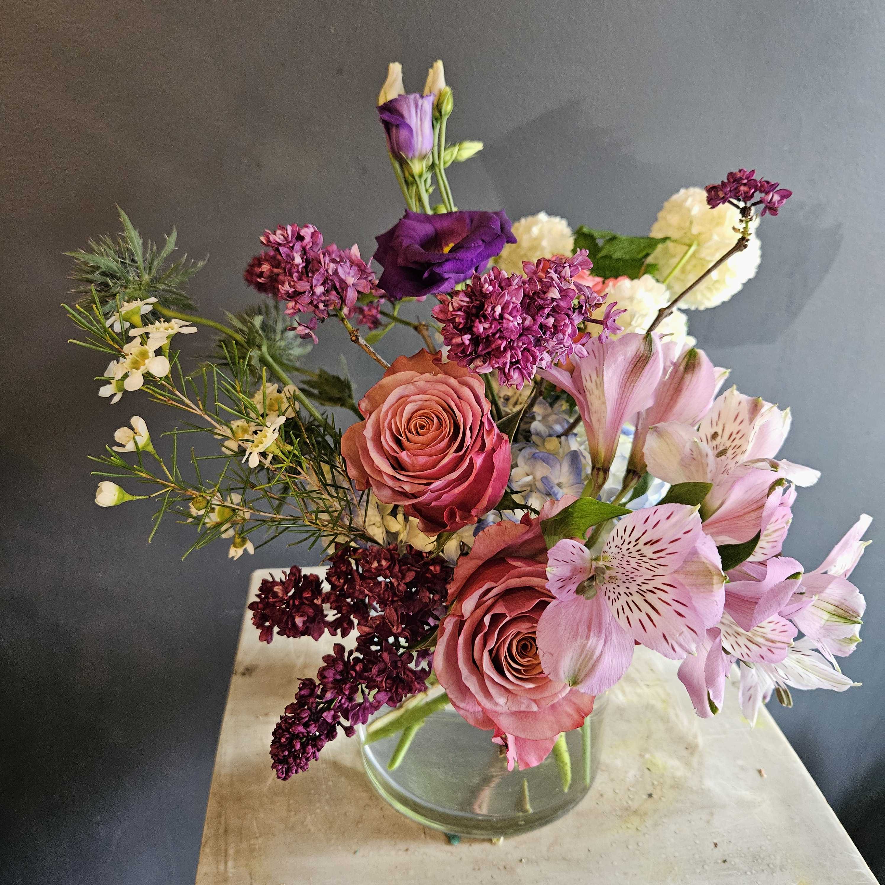 Just for you - This arrangement is about small to medium and will definitely put a smile on her/his face. This is basically DESIGNER'S CHOICE, so colors of flowers and vases are subjects to change. If you want is to use certain colors or flowers, please leave a note for our flowers. Thank you!