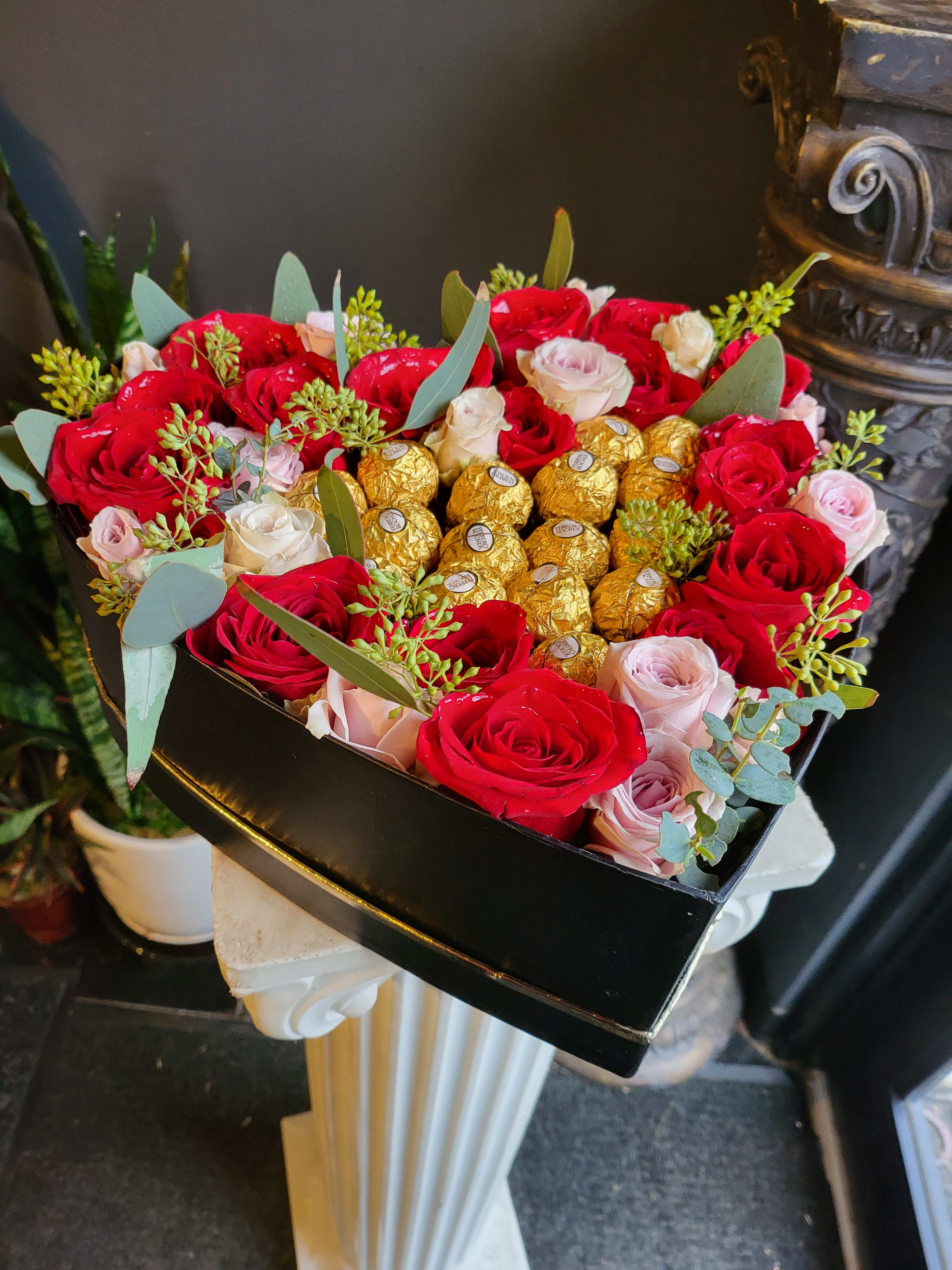 SG41  - Premium Red Roses and Chocolates in a heart-shaped box. LOVE! This arrangement is mixed with light pink &amp; Red roses.