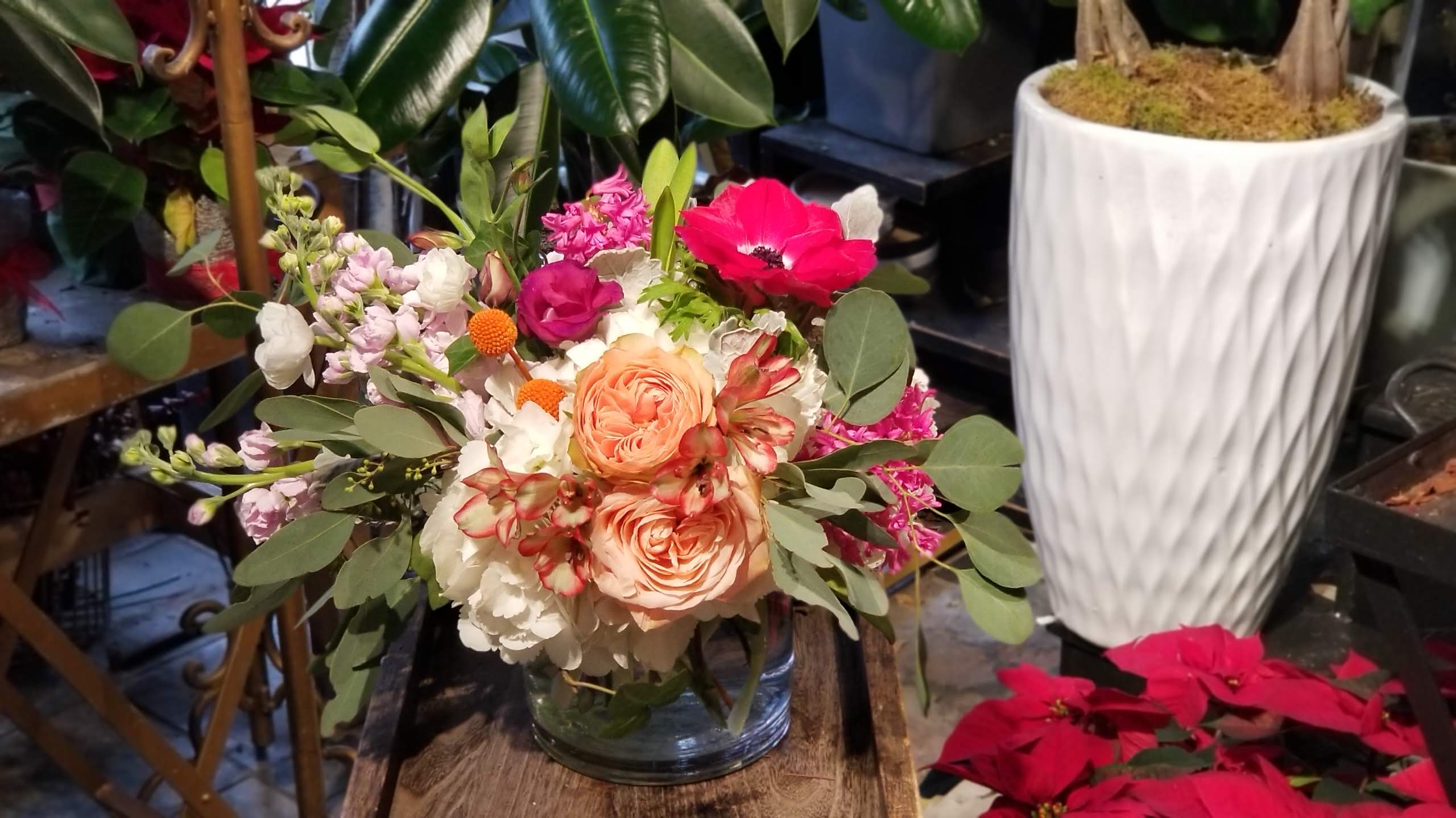 Packed with Love - This is our small arrangement in a vase but its beauty is as Big as it can be. If you want to change colors or make it as hand-tied presentable bouquet with our signature wrapping style, please leave a note to florists when you check out.  Due to various seasonal and regional conditions, and the variety of unplanned issues courtesy of Mother Nature, availability of some flowers may be very limited in certain areas.  In this event, we will substitute with a second choice of similar flowers and container of equal value and beauty. Every effort will be made to maintain size, shape, and overall color schemes of an arrangement. Our goal is your complete satisfaction, rest assured that every effort will be made to provide an arrangement of equal or greater value.