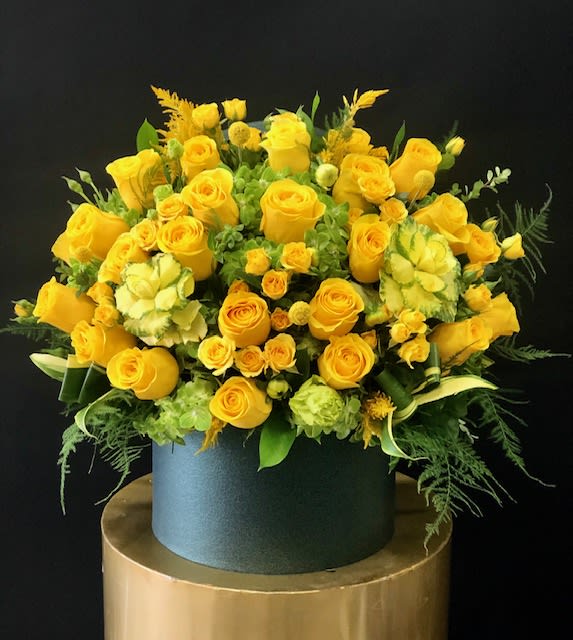 Summer Glow Summer Glow - Summer Glow shines of delicate blooms. The color pallet of yellow and kiwi green is sure to brighten any space. Roses, spray roses, kiwi green hydrangeas, craspedia and greenery On the photo size in standard box. Available in three size options Some florals are seasonal, if particular flower will not be available due to season, we will substitute for similar flower, composition, color pallet and value of the arrangements as closely as possible. All effort to create a floral arrangement as close to the photo shown, the actual arrangement may vary slightly in its appearance from the photo shown. If you have any questions about your order, we welcome you to call us in or email