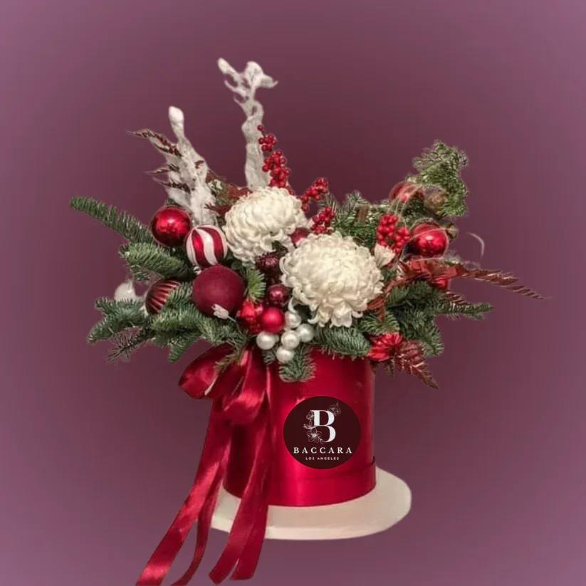 Winter Wonderland: Red & White Floral Arrangement Winter Wonderland: Red & White Floral Arrangement - Bring the magic of the season into your home with our Winter Wonderland floral arrangement! Featuring a stunning combination of crisp white blooms and vibrant red accents, this elegant display captures the essence of winter festivities. Perfect for holiday gatherings or adding a touch of cheer to your decor, this arrangement includes delicate white lilies, bold red roses, and seasonal greenery. Embrace the beauty of winter and create a warm, inviting atmosphere that celebrates the joy and spirit of the season! Disclaimer: Product images are for reference only. Actual flower shades, box colors, and arrangement styles may vary slightly based on seasonal availability and stock. We always strive to match the overall style, color palette, and quality shown in the photos, ensuring every arrangement is fresh, beautiful, and thoughtfully curated.