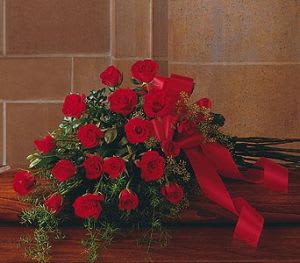 TF 208-2 Red Rose Casket Spray - Casket spray with red roses and specialty greenery tied with ribbon
