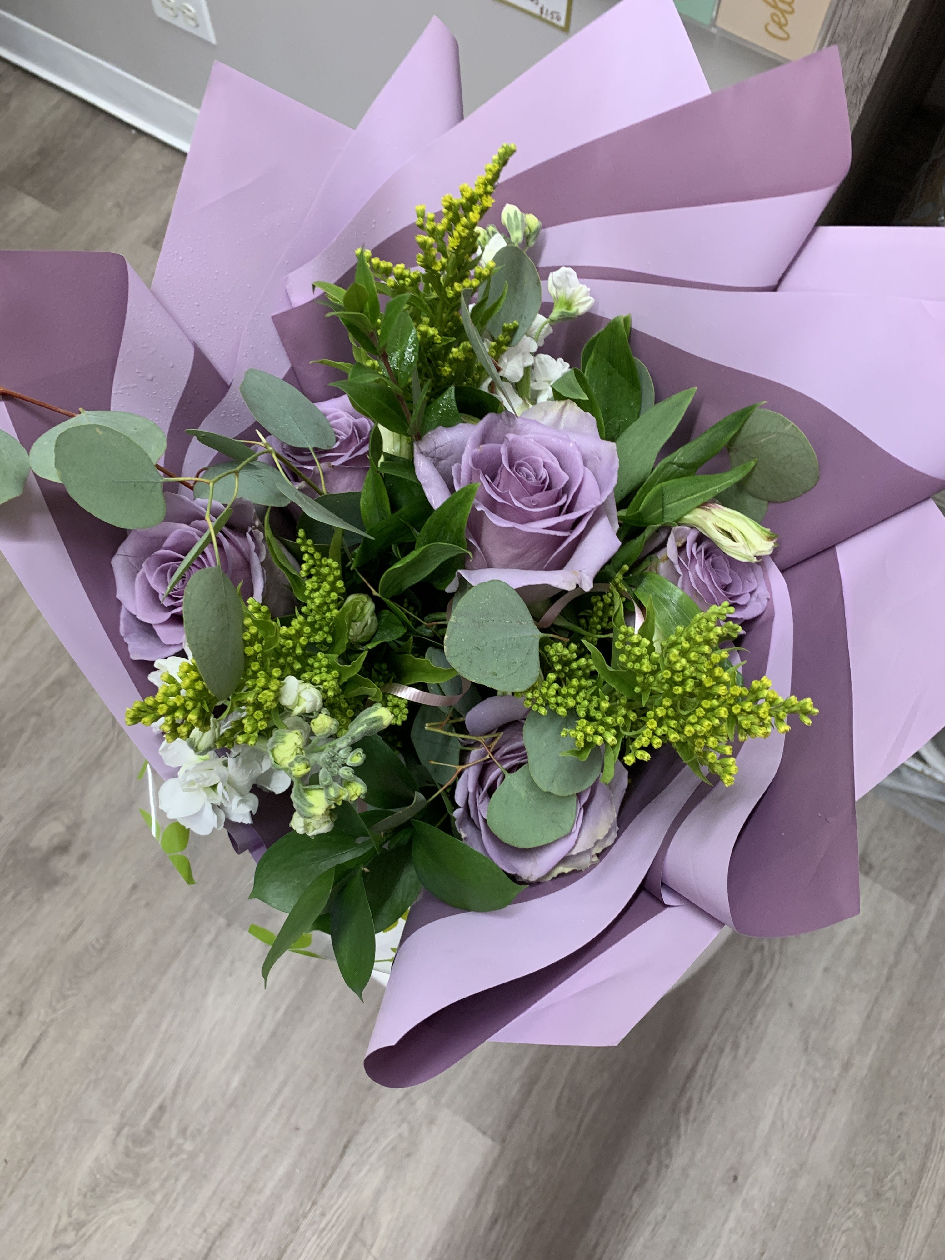 6 Rose Hand Bouquet  - 6 roses arranged together with solidago and eucalyptus in our signature hand bouquet wrapping 
