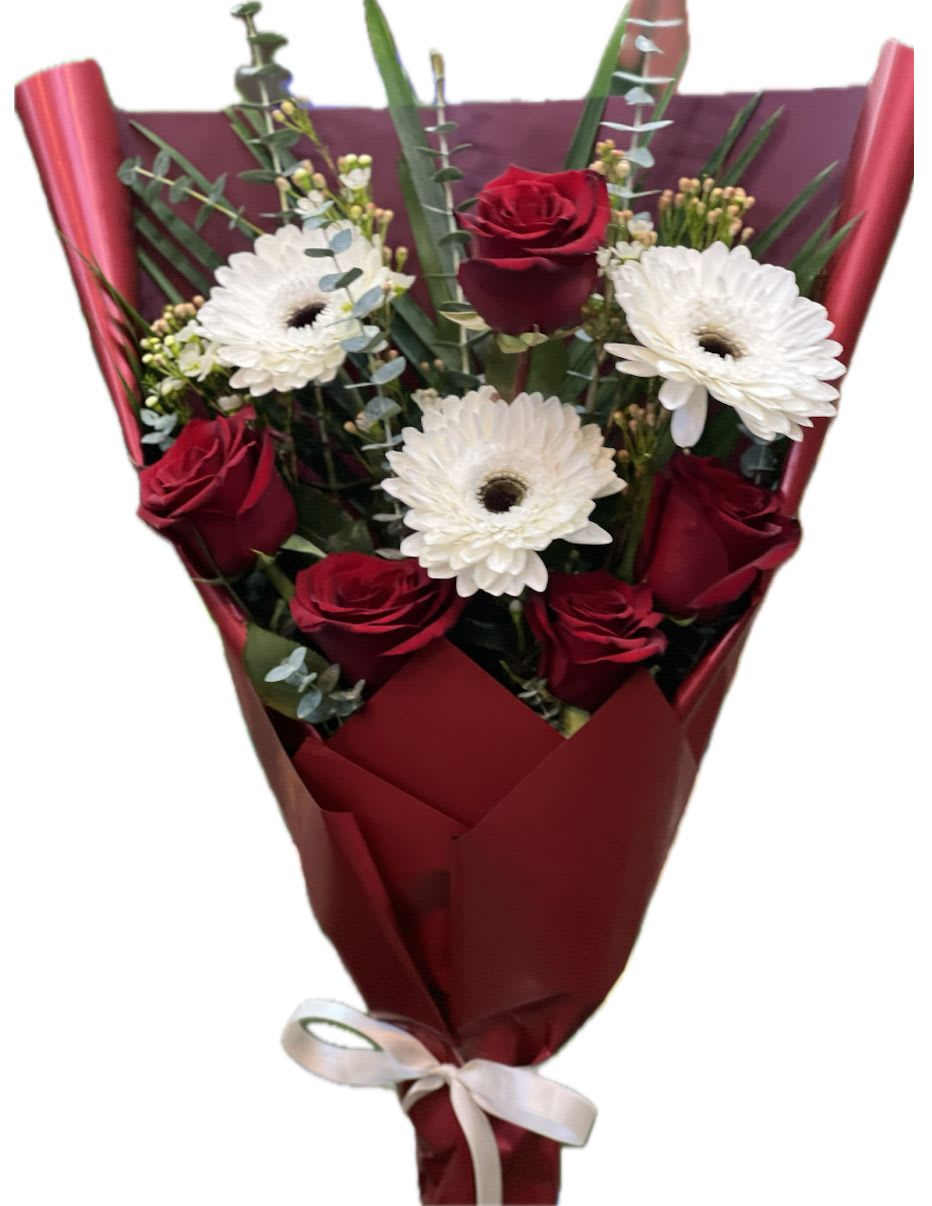 Poetry  - This one-face floral loose Bouquet arrangement features a harmonious blend of white gerbera daisies, red roses, creating a bright and romantic display. The white gerbera daisies provide a fresh, airy base with their crisp petals and vibrant centers, while the deep red  roses add warmth and elegance. The flowers are artfully arranged to form a balanced, yet dynamic design, with each bloom complementing the others in color and form. Perfect for any occasion that calls for a romantic and uplifting bouquet. Please note: Vase not included 