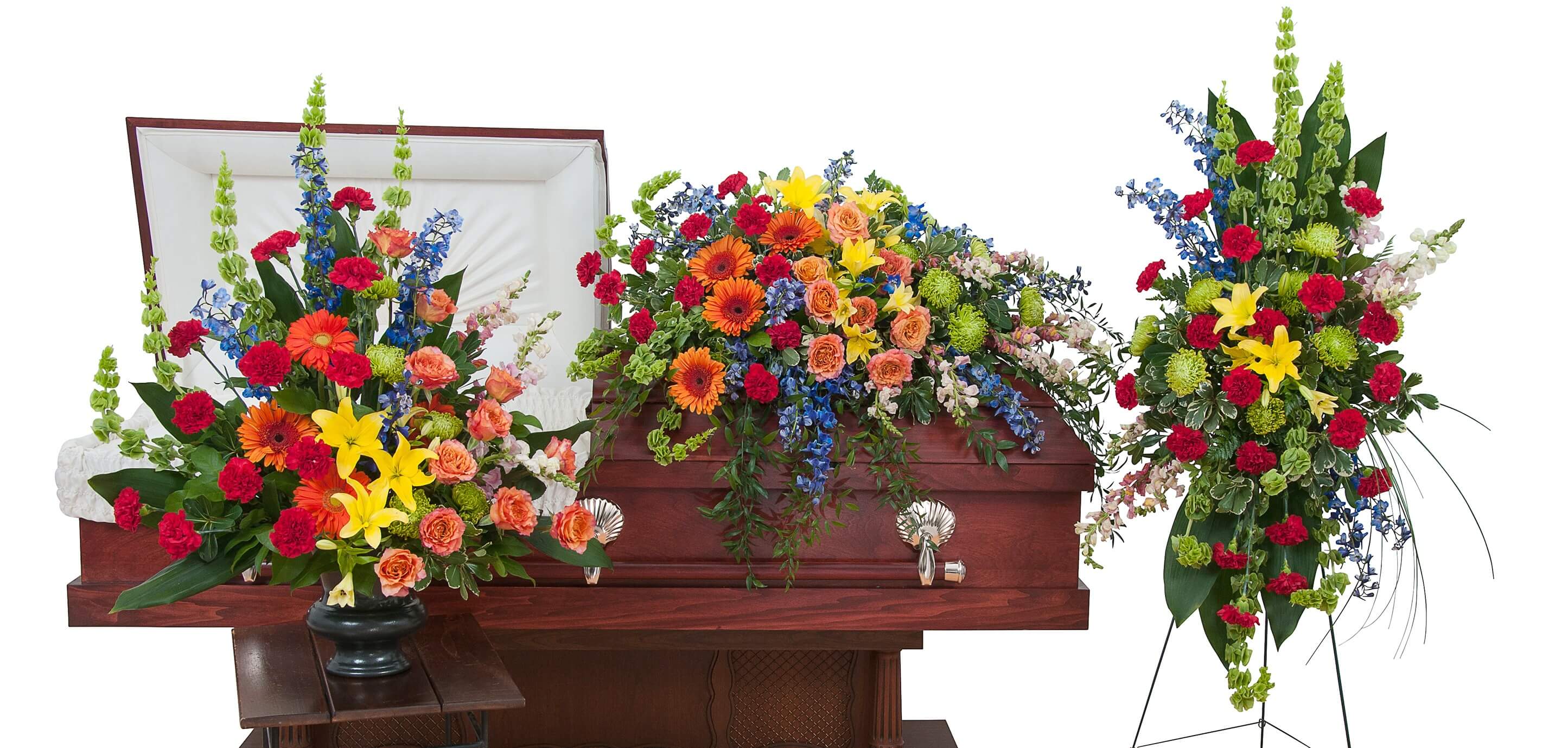Treasured Celebration Trio Treasured Celebration Trio - The treasured celebration trio includes a casket spray, standing easel spray and crescent urn arrangement.