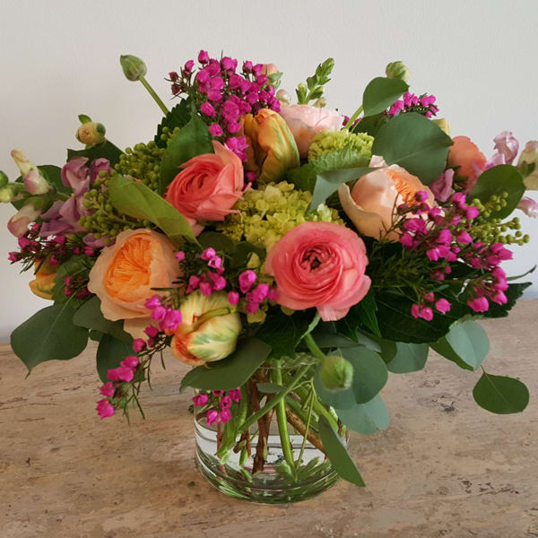 Garden Romance Garden Romance - Stunning garden roses, local parrot tulips(in season), ranunculus and viburnum/hydrangea, snapdragons and other seasonal blooms make up this compact and full beauty. PLEASE NOTE: While we try our best to use all the flowers listed, flower varieties & colors will vary due to availability and season. Our designers always select the freshest blooms for your arrangement.