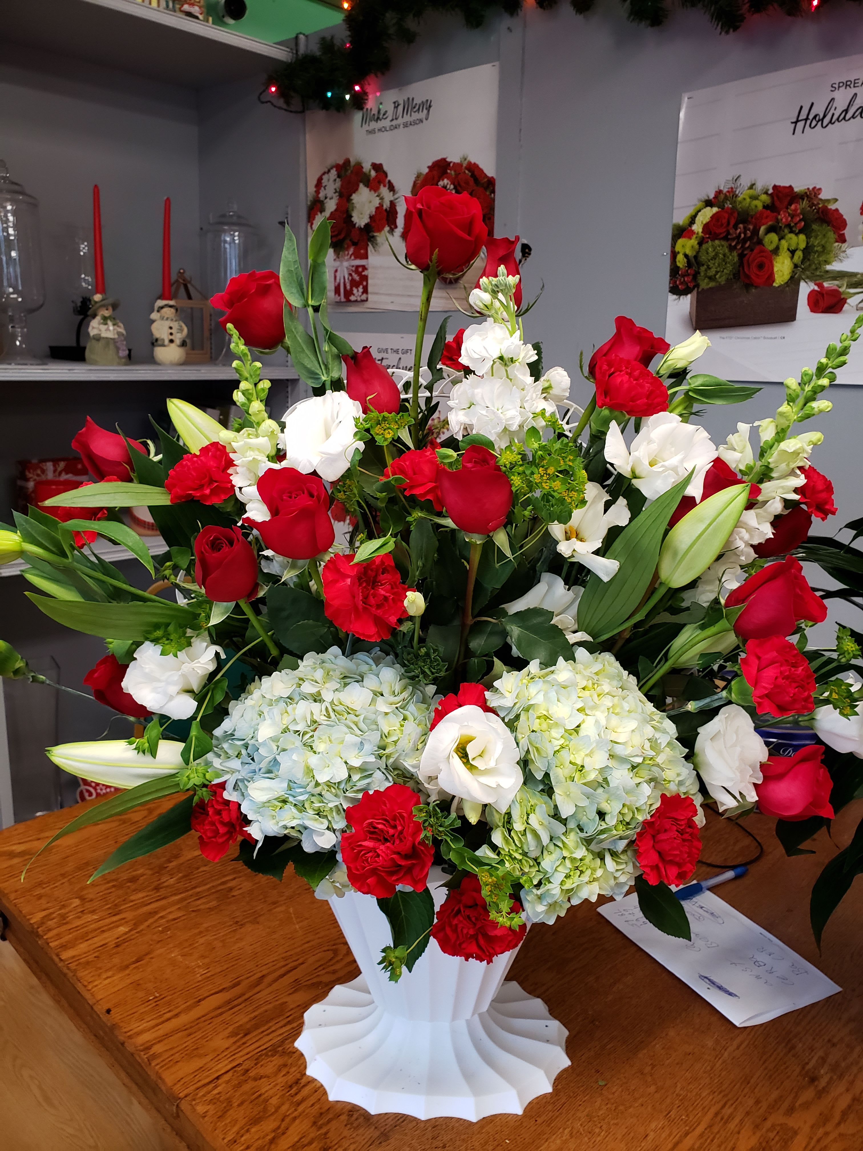 explosion flora - red roses and blue hydrangeas