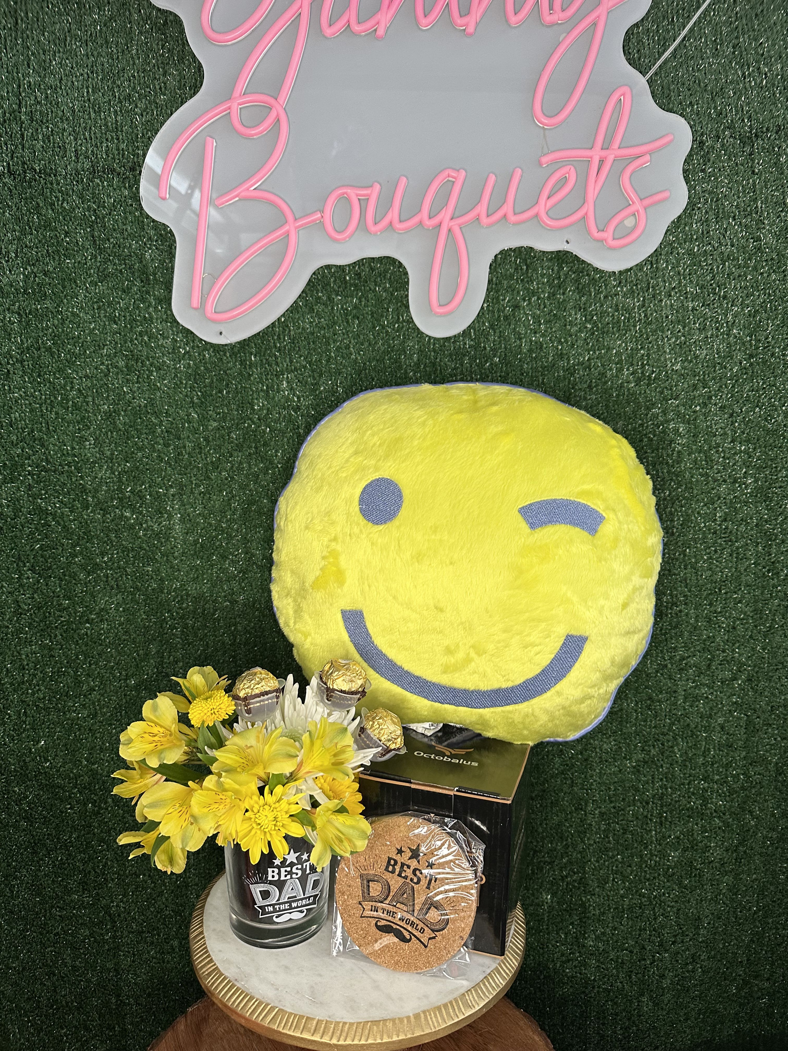 Dad's combo Dad's combo - Whisky glass and coaster with flowers Chocolates and smiley face Flowers and color substitution might apply