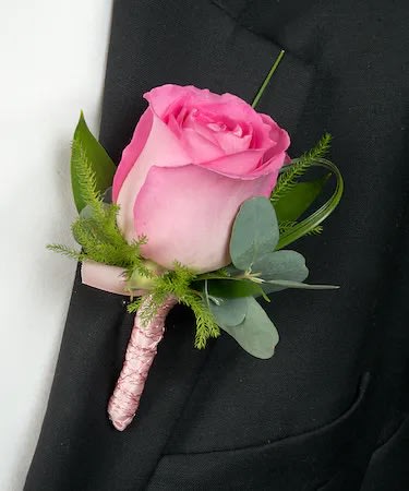 Custom Boutonniere - *Please specify flower and ribbon color in Special Instructions! Flower color options are red, light pink, hot pink, and white. We can do any color ribbon!* A traditional boutonniere tailored to your color preferences. Features either miniature 2 roses or one full rose, baby's breath filler, and greenery wrapped in ribbon of your choice.