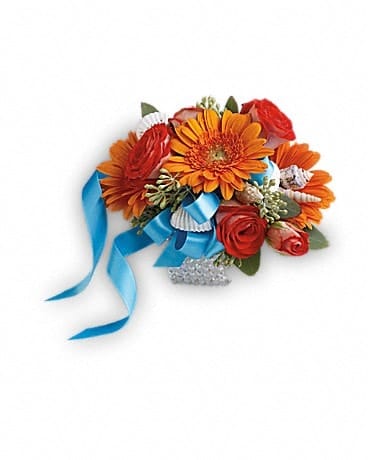 Sunset Magic Corsage Sunset Magic Corsage - Glorious orange roses and gerberas accented with charming seashells for a magical, beachside feel. Dark orange spray roses and miniature orange gerbera with small seashell accents.