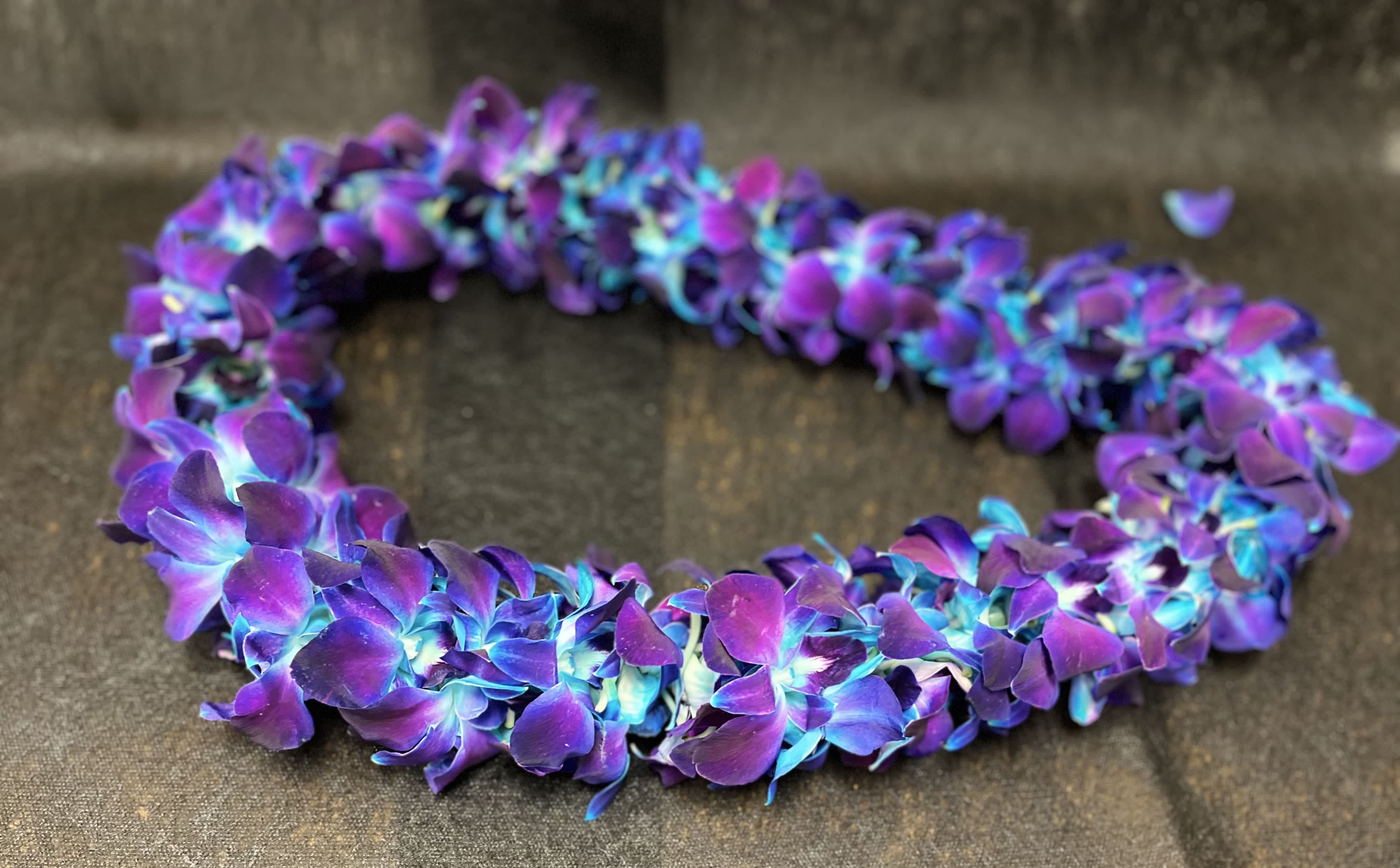 GRADUATION LEIS DOUBLE .1 GRADUATION LEIS DOUBLE .1 - "Order a beautiful Double Orchid Lei for Graduation Season! Available in: White & Bombay purple. Please note we keep fresh, ready-to-go leis during graduation season (5/15-6/15). If you would like to order one outside of the season, please order 48hrs in advance to ensure delivery/pickup date. Thank you! STANDARD"