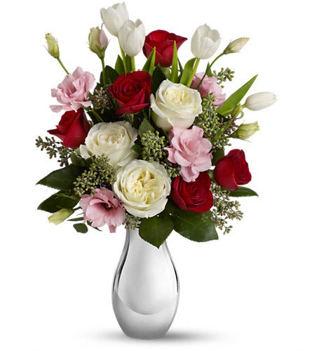 Teleflora's Love Forever Bouquet with Red Roses Teleflora's Love Forever Bouquet with Red Roses - Tickle her heart with this flirtatious mix of romantic roses lisianthus and tulips. This bouquet is arranged in our elegant Silver Reflections vase. It's a vase she's sure to hold on to - and it'll always remind her of you. This feminine bouquet features large white and red roses delicate pink lisianthus elegant white tulips and seeded eucalyptus and comes delivered in our exclusive Silver Reflections vase a metalized ceramic vase with a light pink tone.Approximately 13 3/4" W x 19" H Orientation: One-Sided As Shown : T400-1ADeluxe : T400-1BPremium : T400-1C