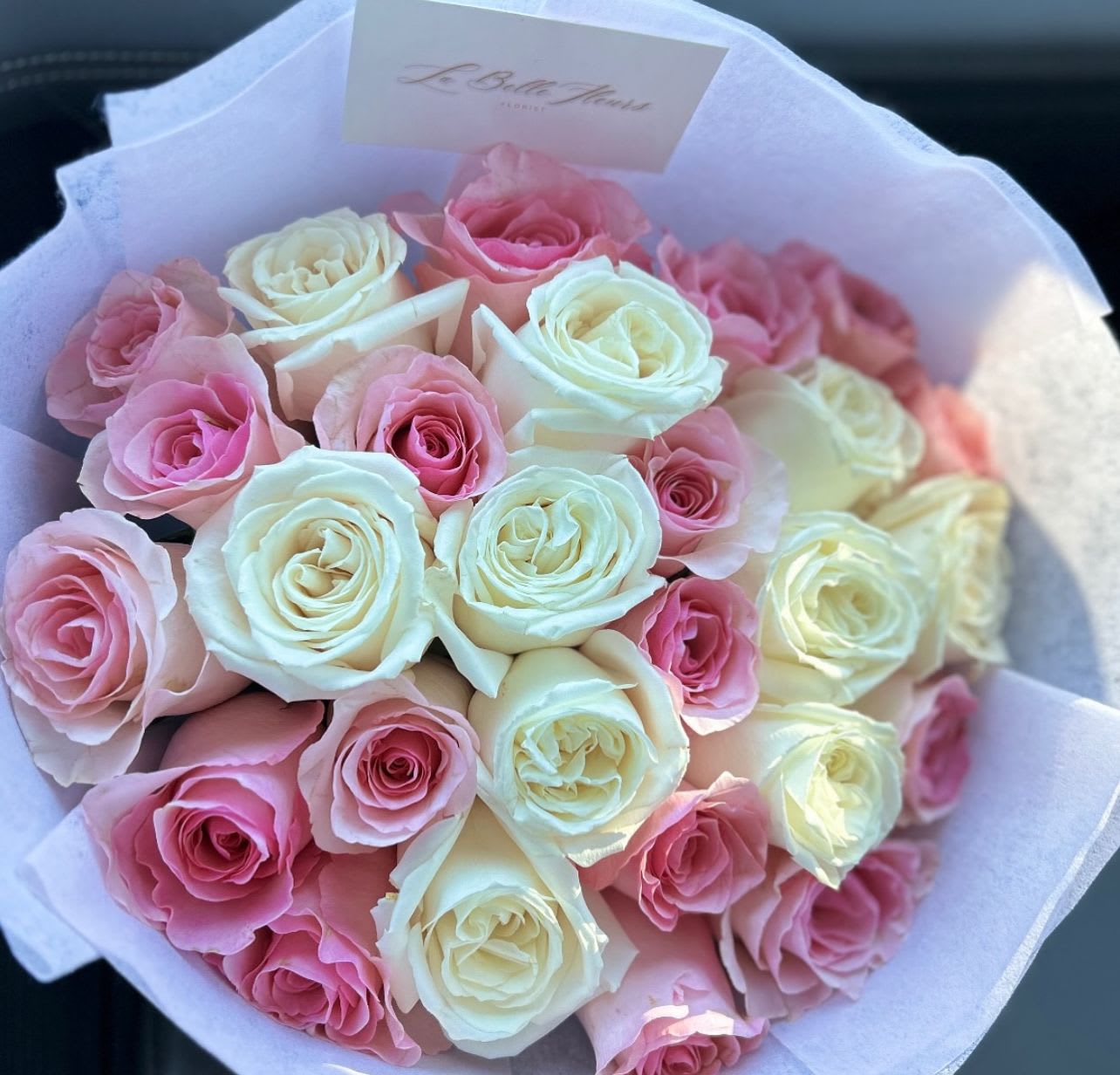 Blush Elegance  Ramo Bouquet - This stunning arragenment features a harmonious blend of soft pink and white roses. 