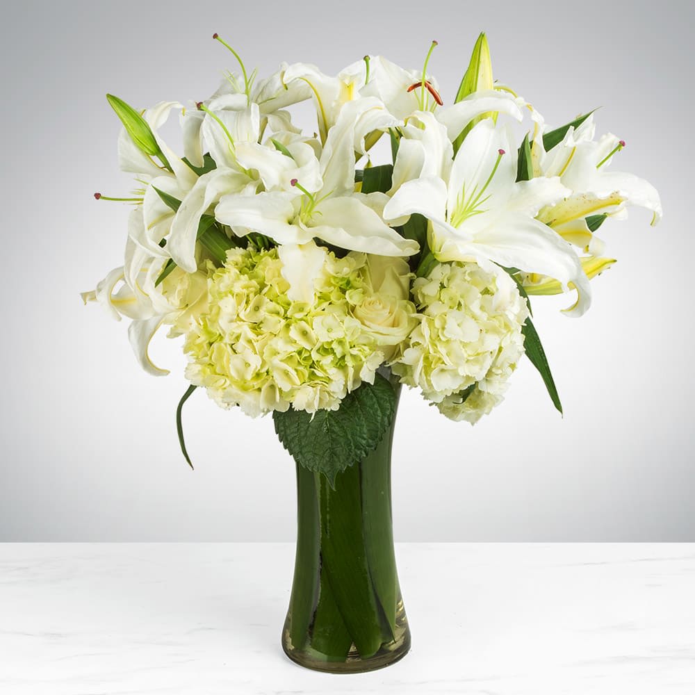 Sincere Thoughts by BloomNation™ Sincere Thoughts by BloomNation™ - Send your condolences with this White Lily and Hydrangea arrangement. APPROXIMATE DIMENSIONS: 16" D x 20.5" W