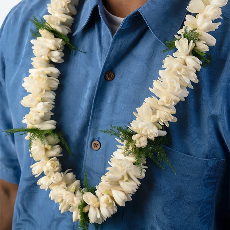 Hawaiian Double Tuberose Lei (Pick up only) Hawaiian Double Tuberose Lei (Pick up only) - Celebrate special occasions with our exquisite Tuberose lei, featuring locally grown tuberose flowers. This lei is a more feminine choice, known for its delicate beauty and captivating fragrance. Key features include: Locally Grown: Made with fresh, locally sourced tuberose flowers, ensuring high quality and authenticity. Feminine Elegance: Designed to be a more feminine lei, perfect for women on special occasions such as weddings, anniversaries, and celebrations. Captivating Fragrance: Tuberose flowers are renowned for their delightful and lasting fragrance. Delicate Beauty: The lei’s delicate design adds a touch of elegance and sophistication to any event. Embrace the delicate beauty and enchanting scent of our Tuberose lei, perfect for making any special occasion unforgettable.