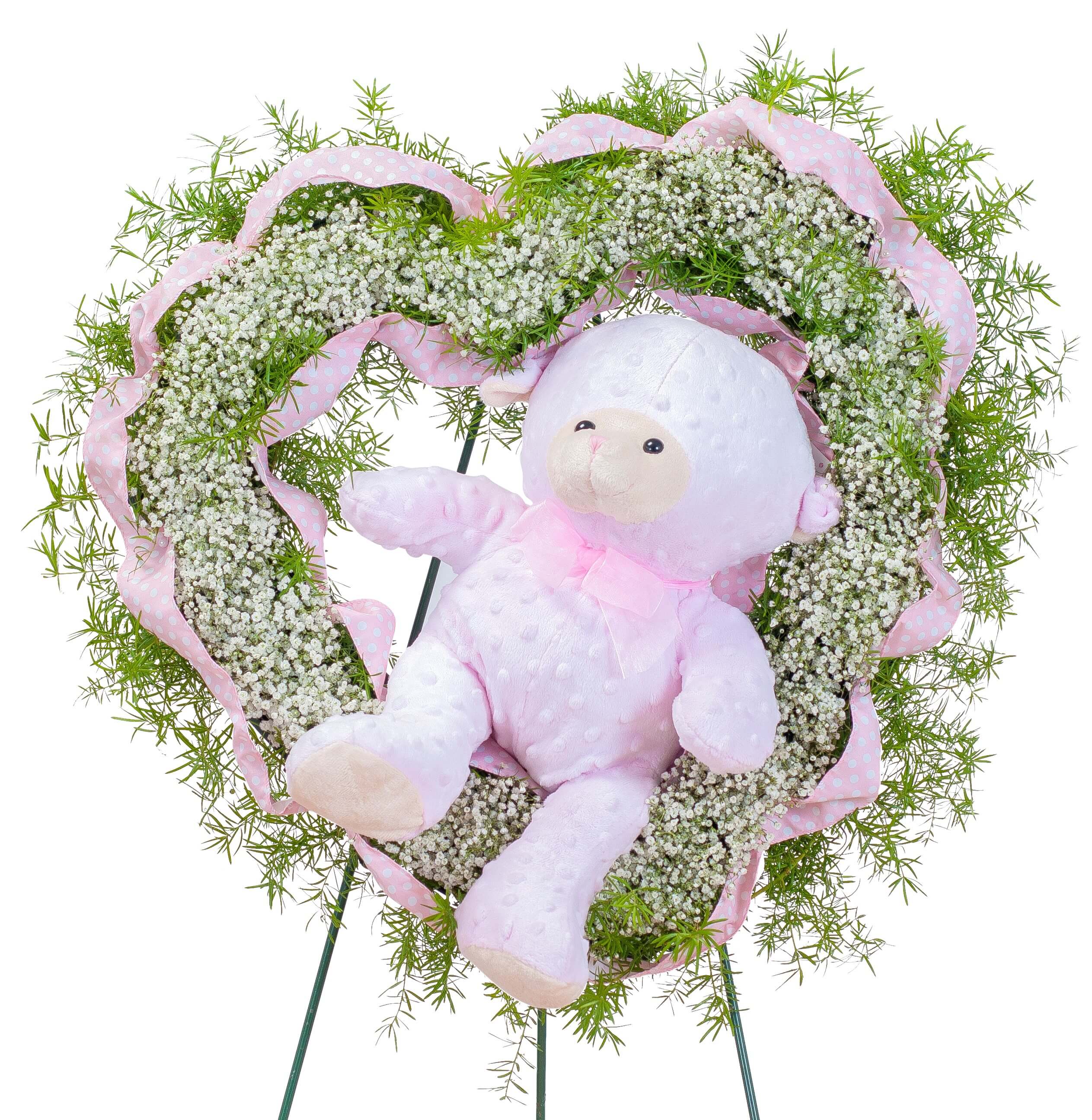 Tiny Angels Wreath in Pink Tiny Angels Wreath in Pink - A heart of sweet white baby's breath surrounded by pink ribbon with a plush bear seated inside is a perfect tribute for a tiny angel.