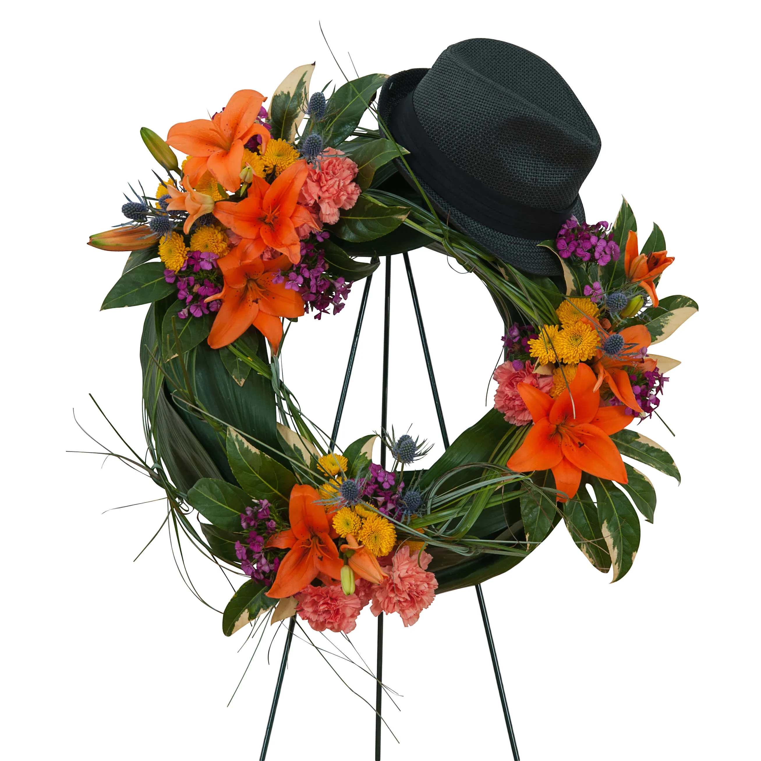 Remembering the Good Times Wreath Remembering the Good Times Wreath - Lilies and a variety of bright color blooms add to the personalization of a wildflower look. (hat supplied by customer)