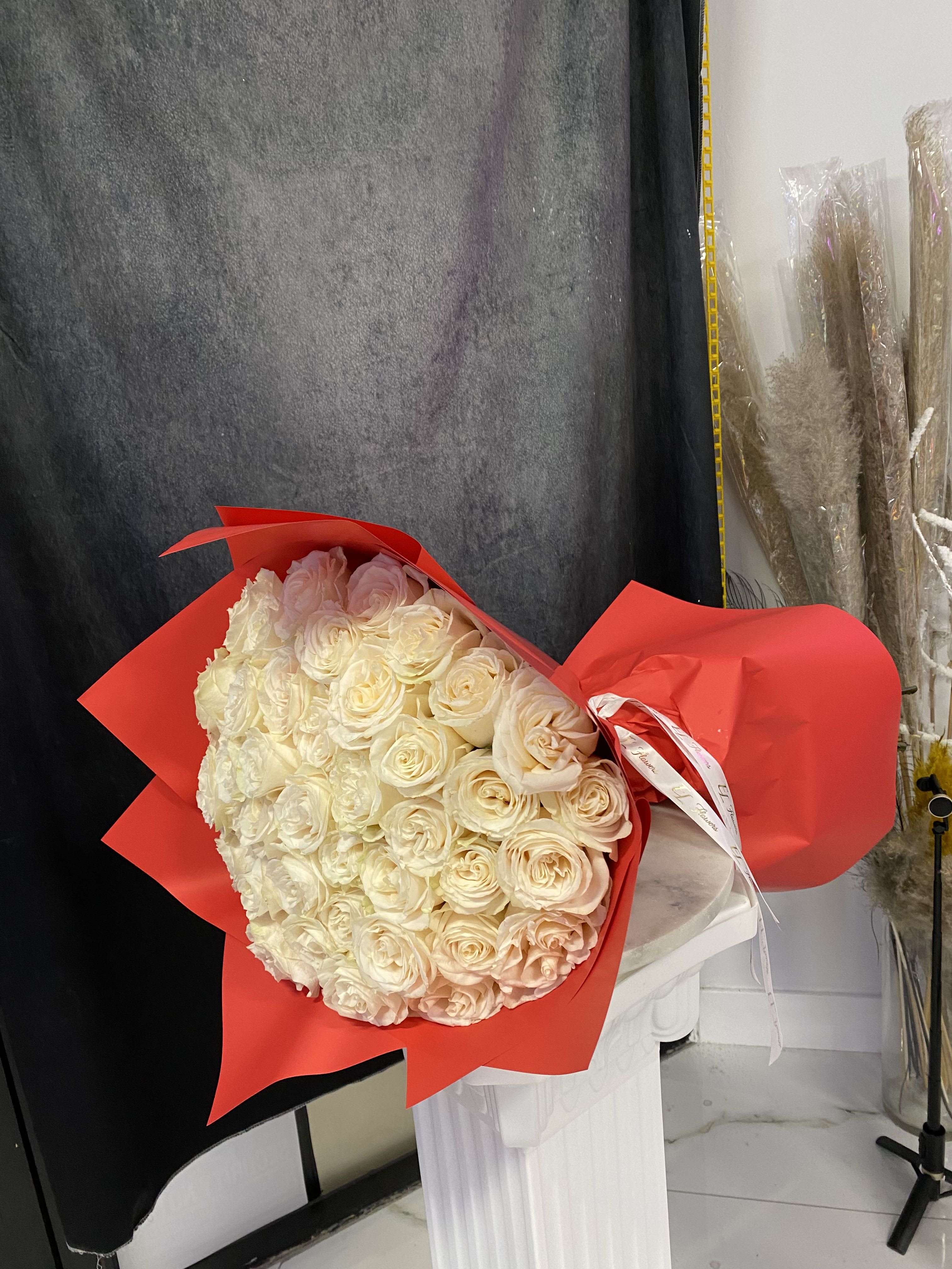 50 white roses wrapped 50 white roses wrapped - beautiful and fresh 50 white roses with beautiful wrapping
