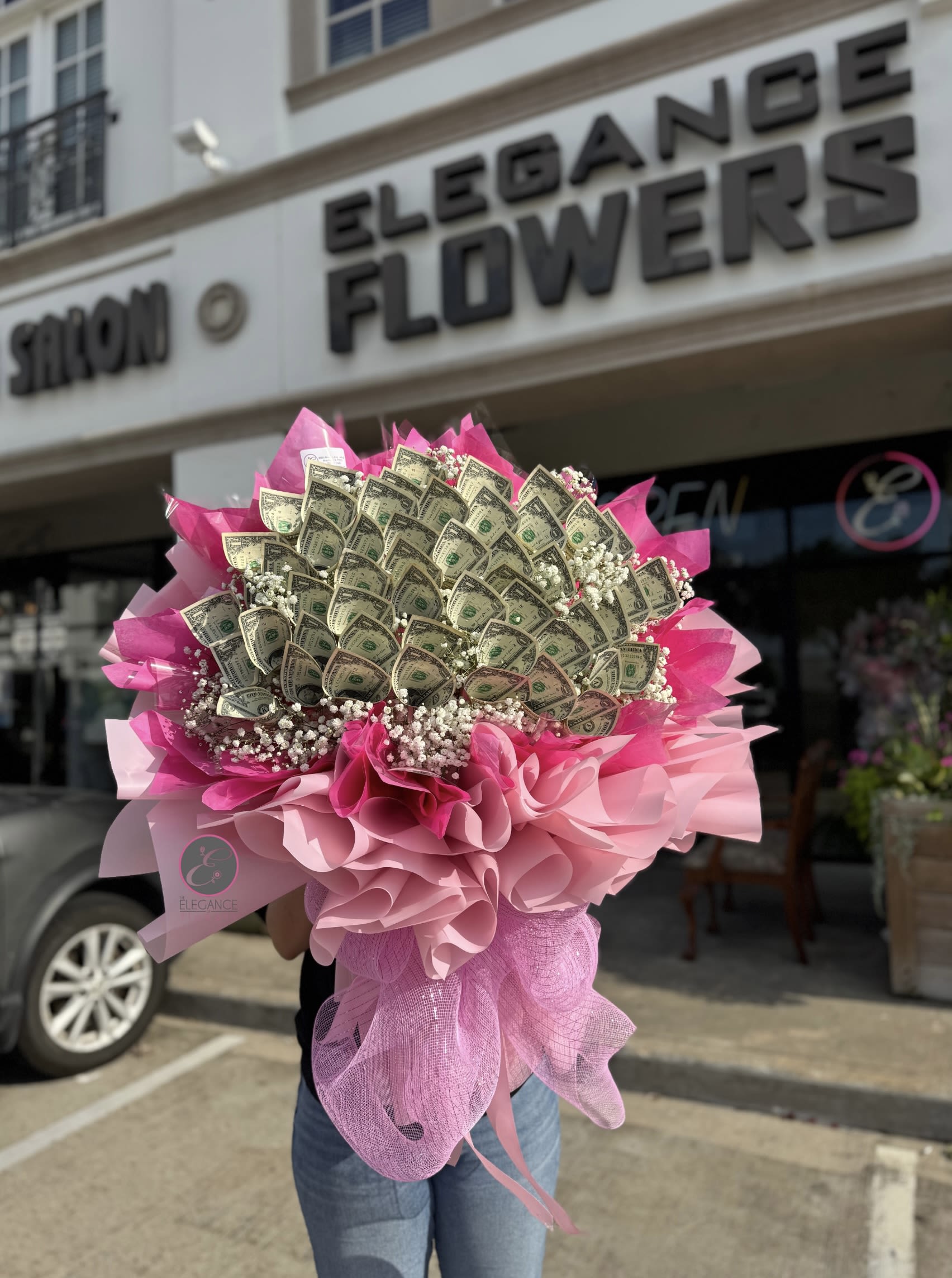Money Box #1 Money Box #1 - Includes $1x 50 ($50), call for more information at 281-564-2600. Money bouquets are unique arrangements featuring dollar bills. They make a creative and luxurious gift for special occasions like birthdays, anniversary, or graduations, combining elegance with practicality.