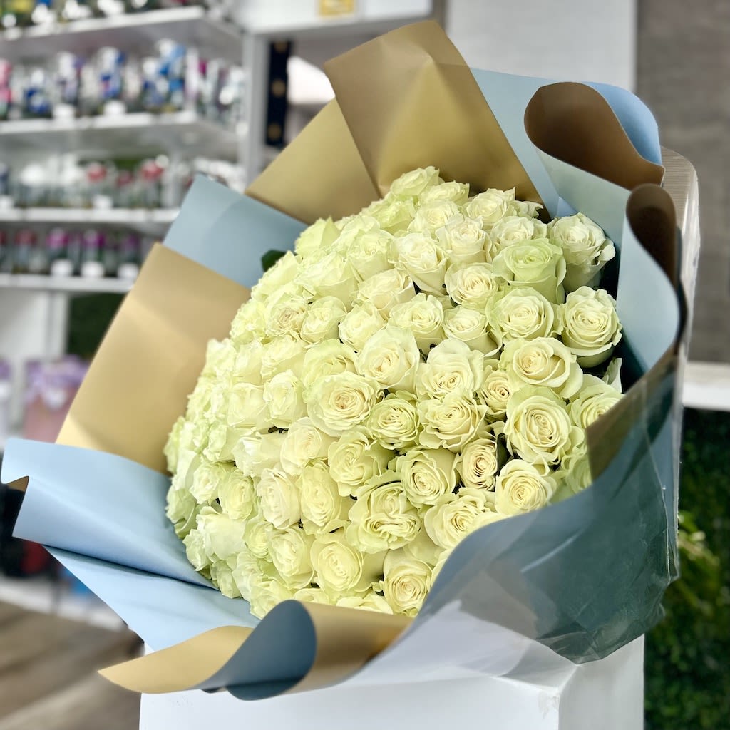 100 Roses Round EuroBouquet - White - 100 Roses Round Euro Bouquet: Fresh cut Roses with European style wrapping in our deluxe floral paper accented with a decorative bow and a personalized card note. Ideal gift with great look! (NO VASE INCLUDED)