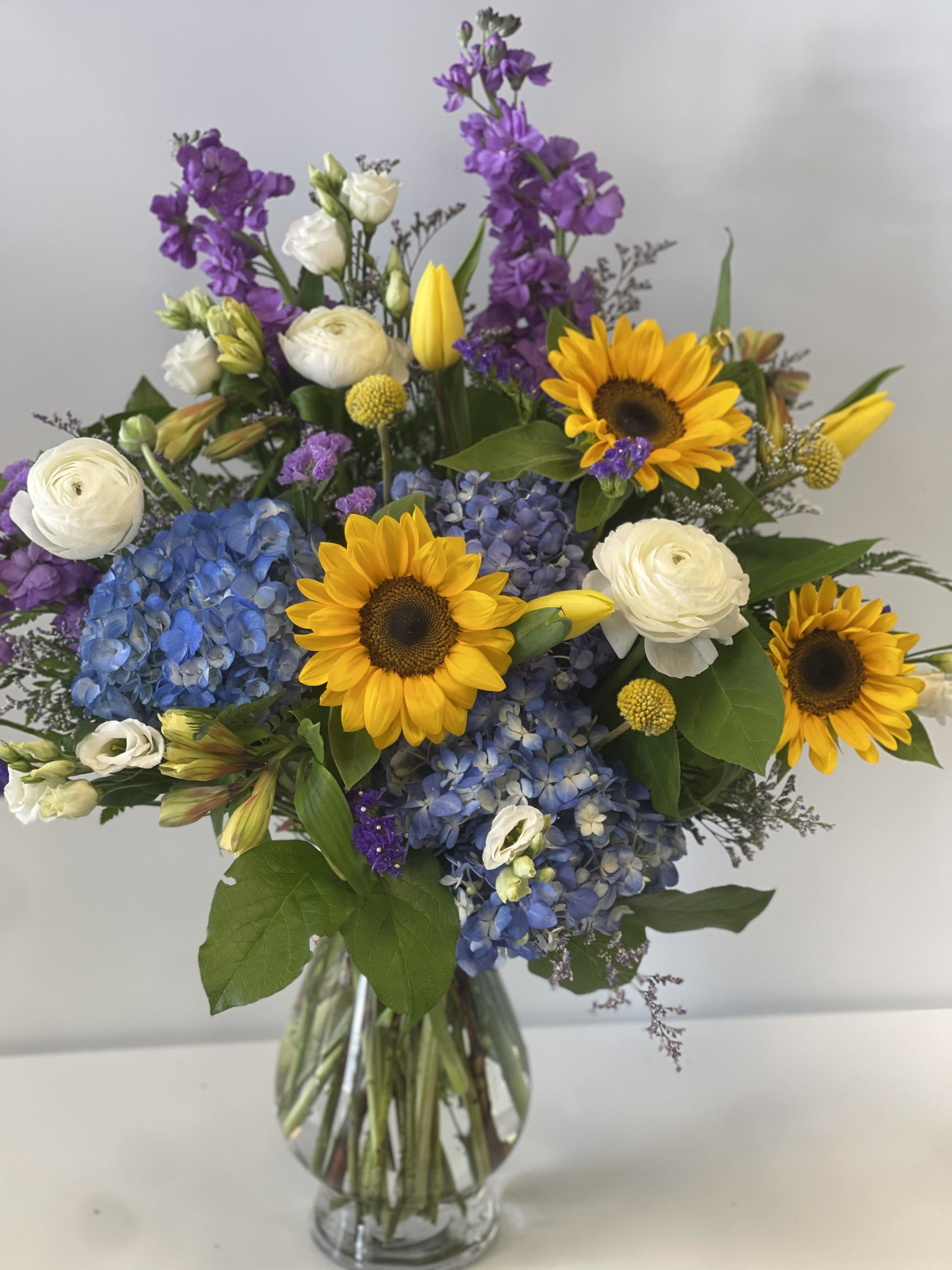 Sunburst  - Sunflowers bursting with color in this beautiful arrangement! 