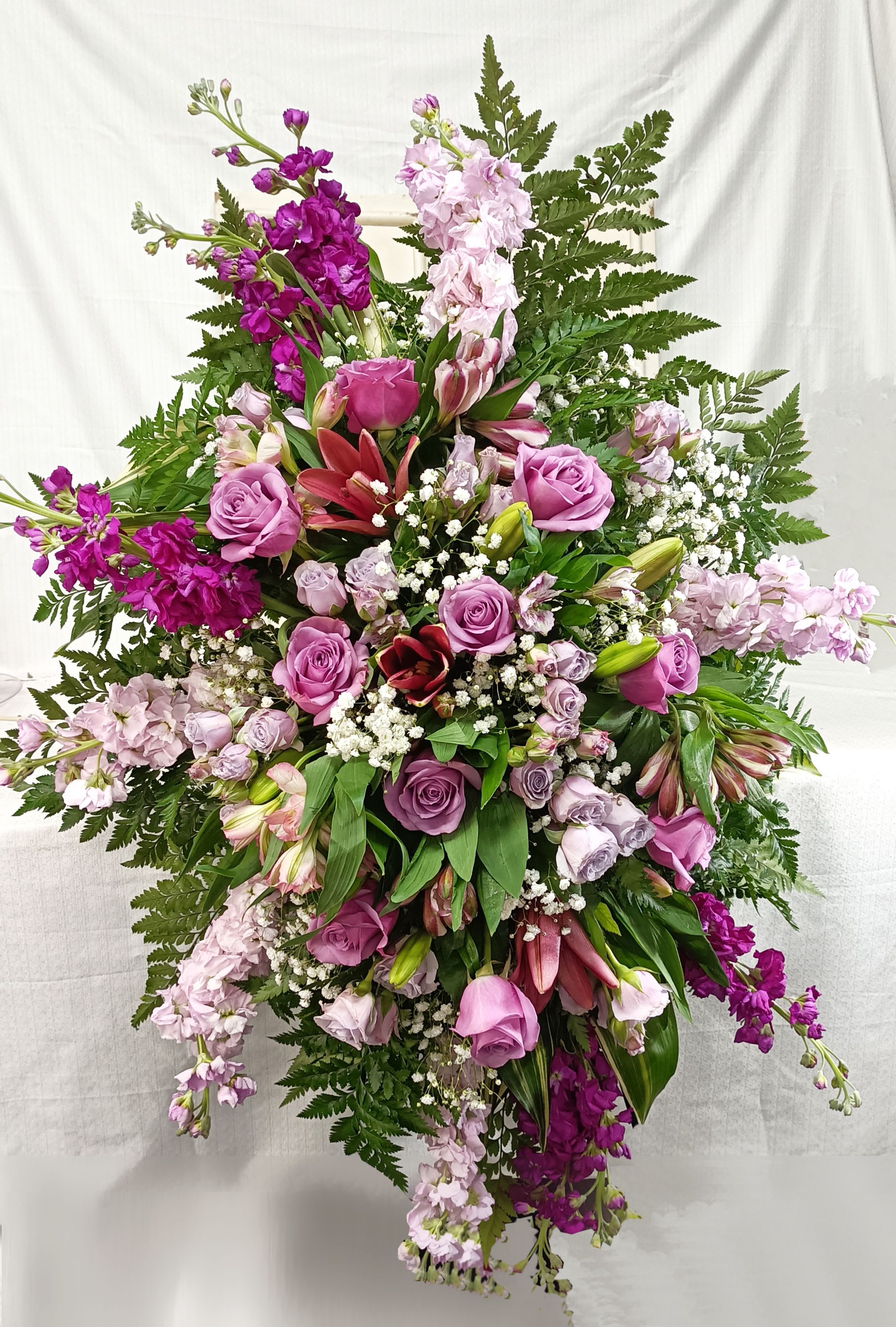 Purple Lovers Spray - Beautiful purple stock, Roses, and dark pink lilys make up a beautiful spray