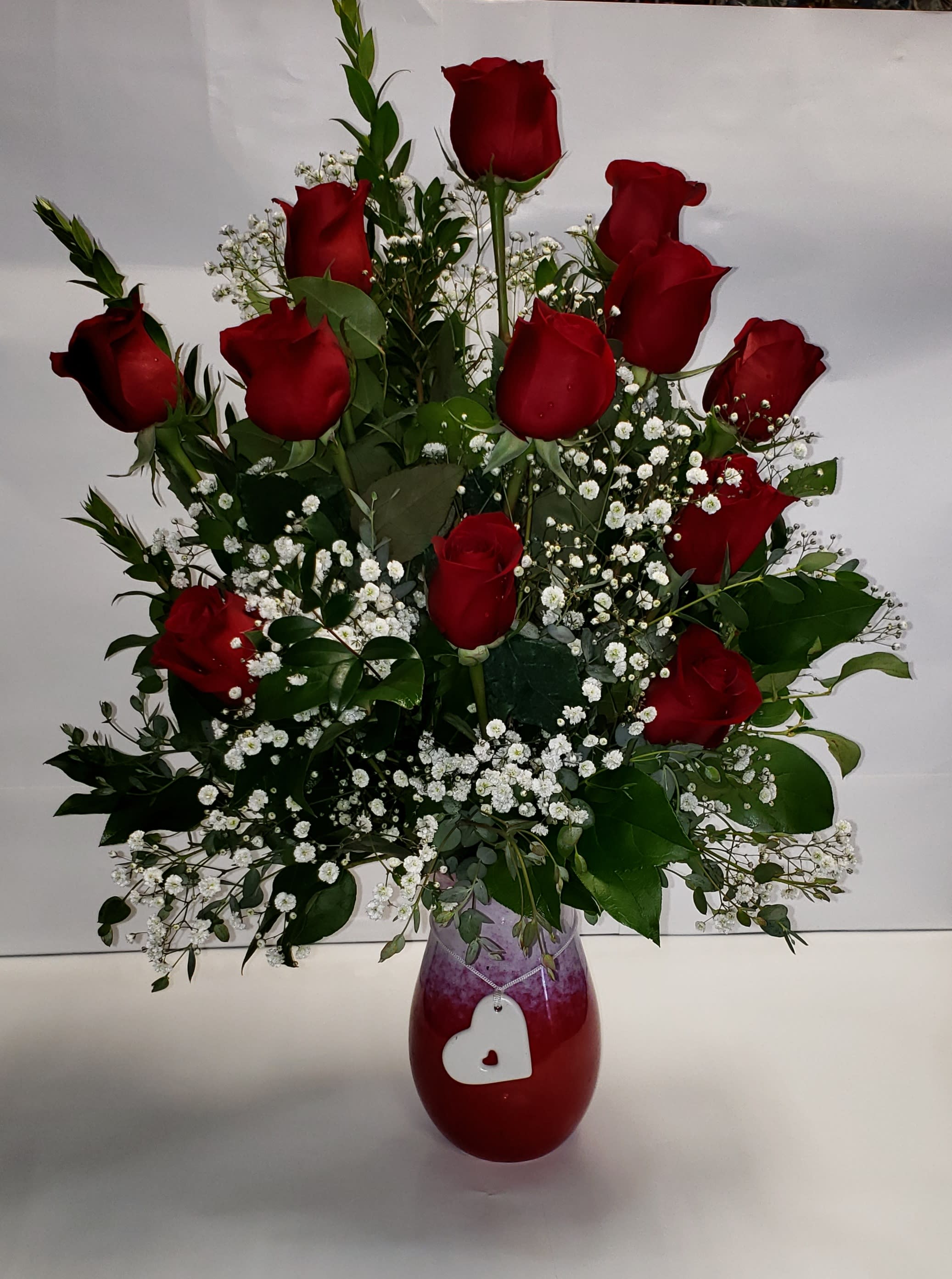 Charmed  - Wrap her in romance with this romantic rose bouquet, presented in a stunning stoneware vase with artisanal reactive glaze, chic ombre style and white ceramic heart charm.
