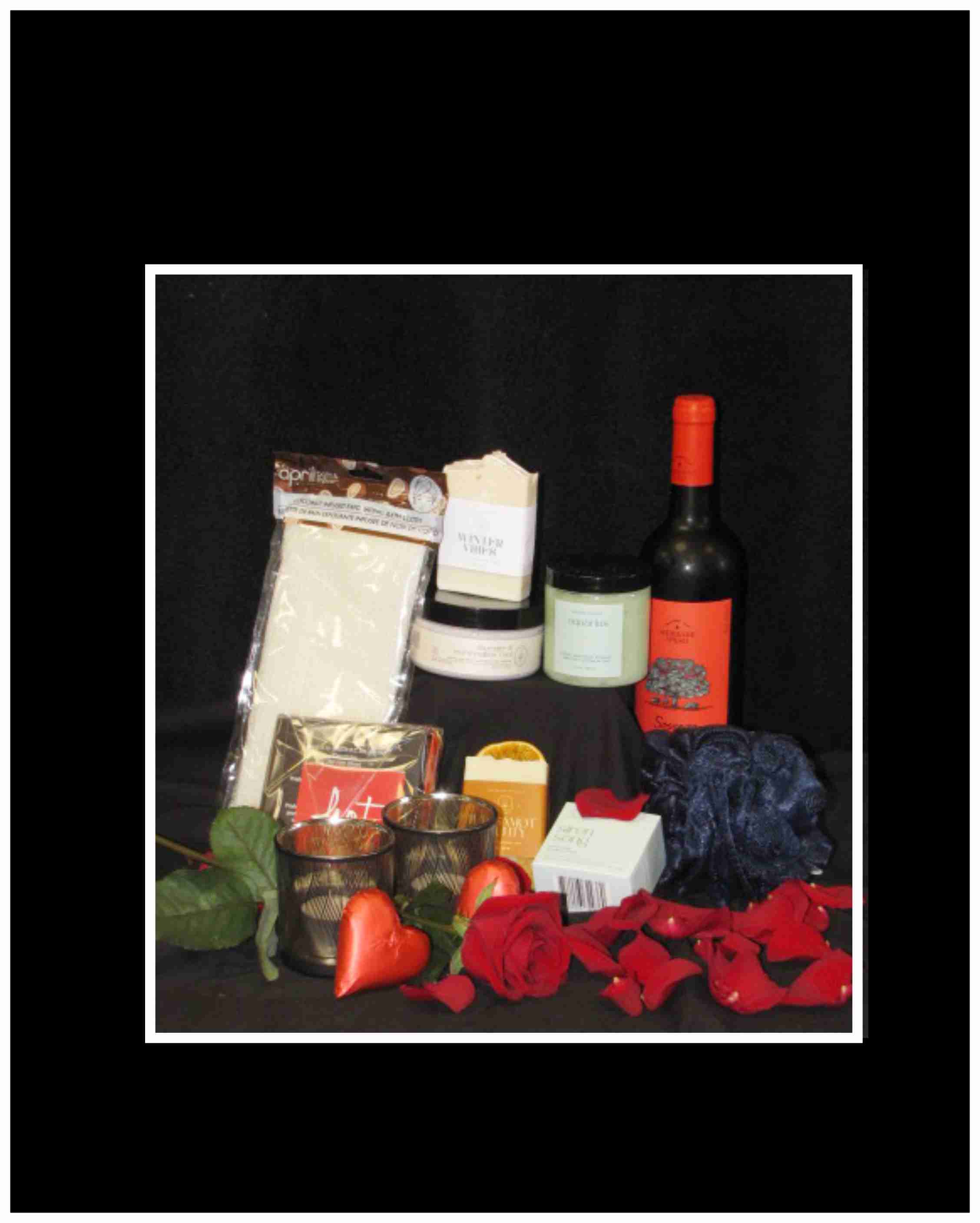 Intimate Escape Spa Basket Intimate Escape Spa Basket - Time out for just the two of you. A basket that features our local Hot Chocolates from Courtney, Candles, wine , pure ingredient body scrubs, bath bombs and soaps from Matka Botanical. An experience to relax in together