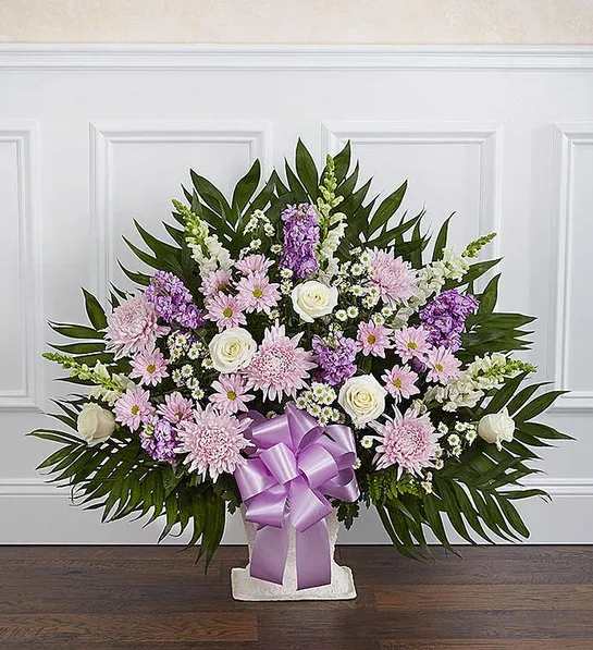 Tribute Lavender &amp; White - In times of loss, expressing the love you feel in your heart is not always easy. Our elegant floor basket arrangement in graceful hues, handcrafted by our caring florists with soothing lavender and white blooms, is a tasteful gesture perfectly suited for the funeral home or memorial services.