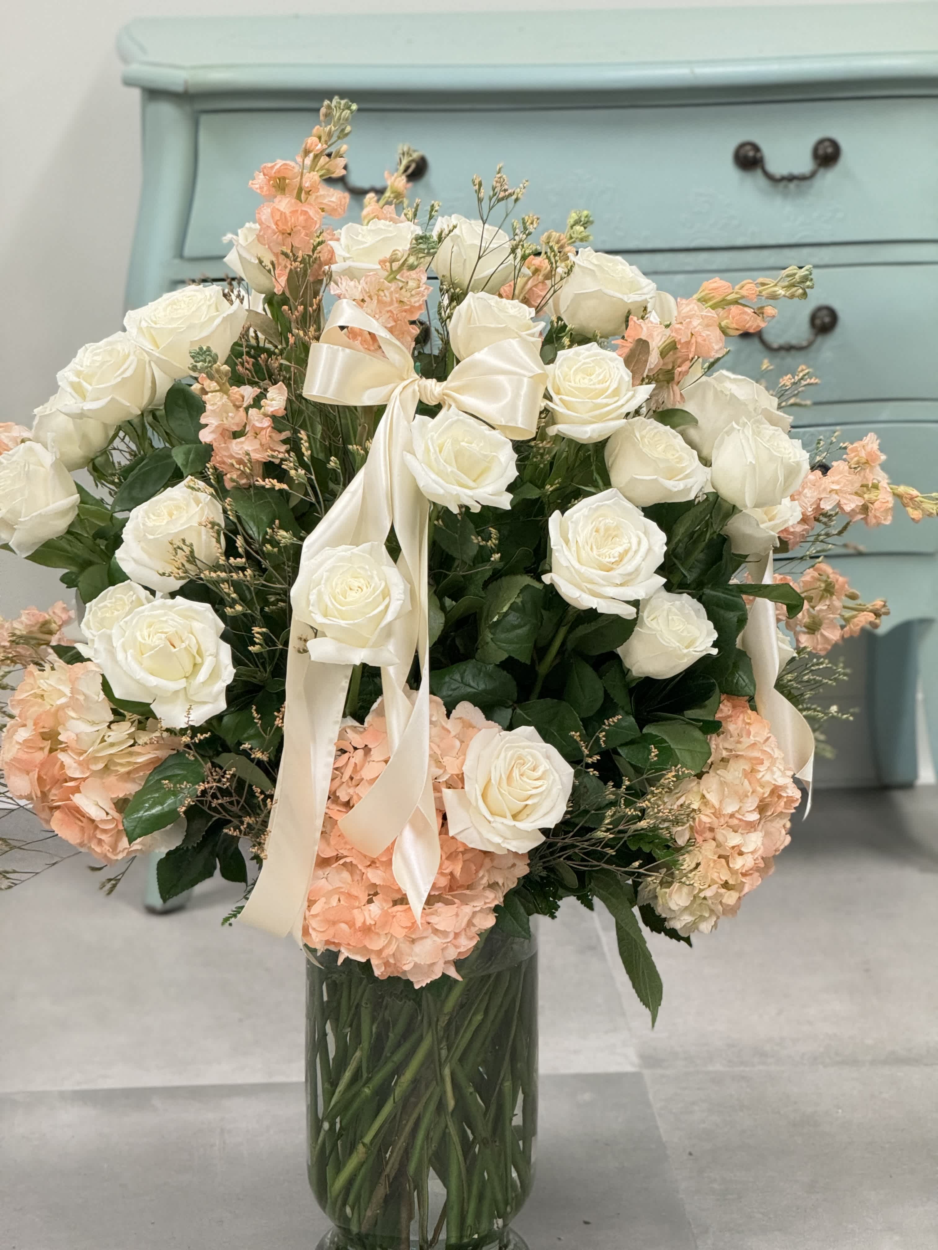 Bow-tiful! Bow-tiful! - Absolutely stunning arrangement on 4 dozen roses and hydrangea that is customizable with color! *Please note the color you would like at checkout. Bows may vary with material.